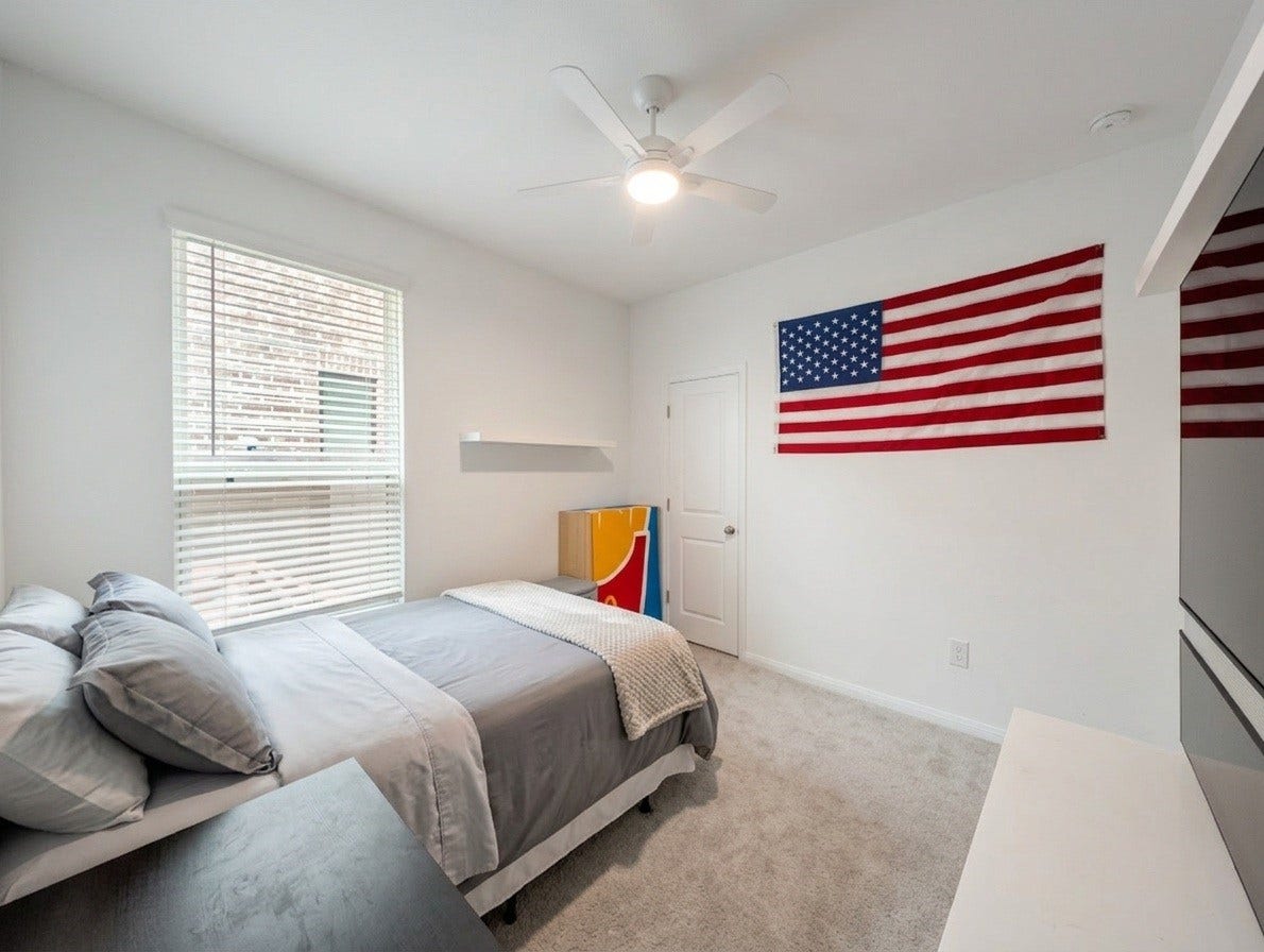 18122 Sonresa Way, Tomball, TX 77377 Comfortable secondary bedroom featuring plush carpeting, a ceiling fan, large windows, and neutral decor.
