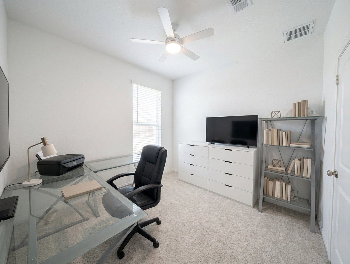 18122 Sonresa Way, Tomball, TX 77377 Versatile room set up as a home office or study space, featuring a desk setup and closet access.