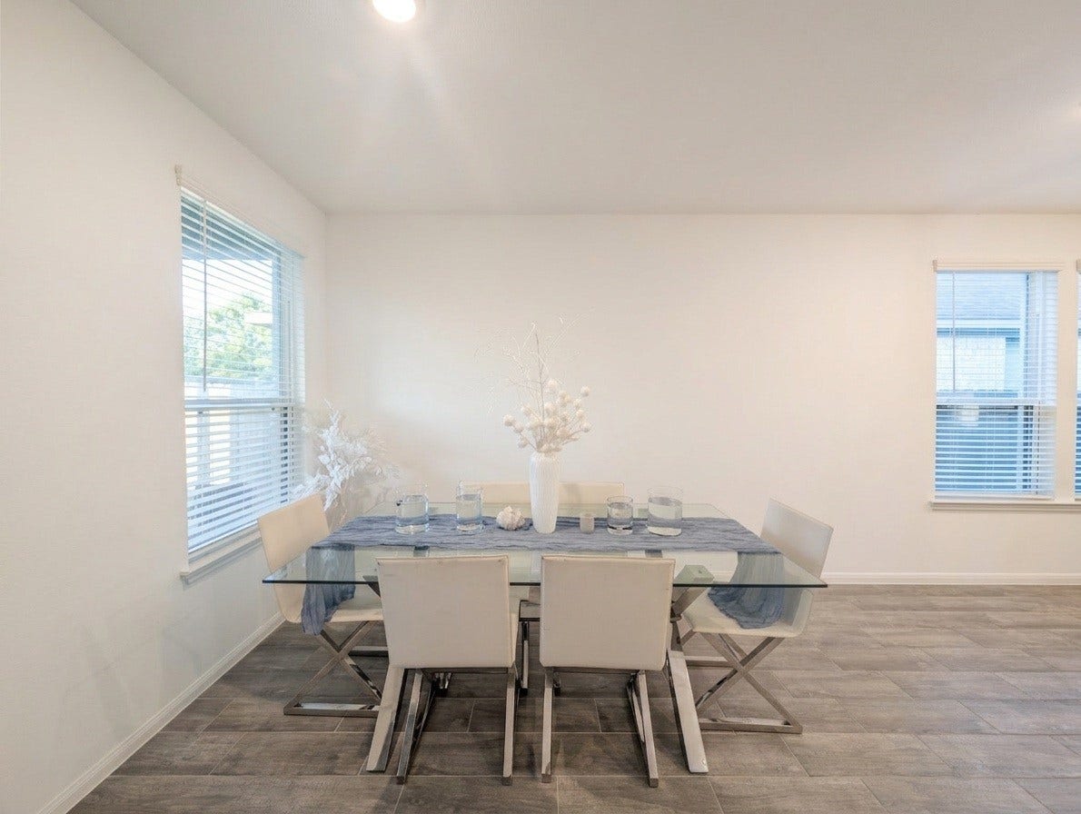 18122 Sonresa Way, Tomball, TX 77377 Bright dining or breakfast area featuring large windows with natural lighting and an open flow into the living space.