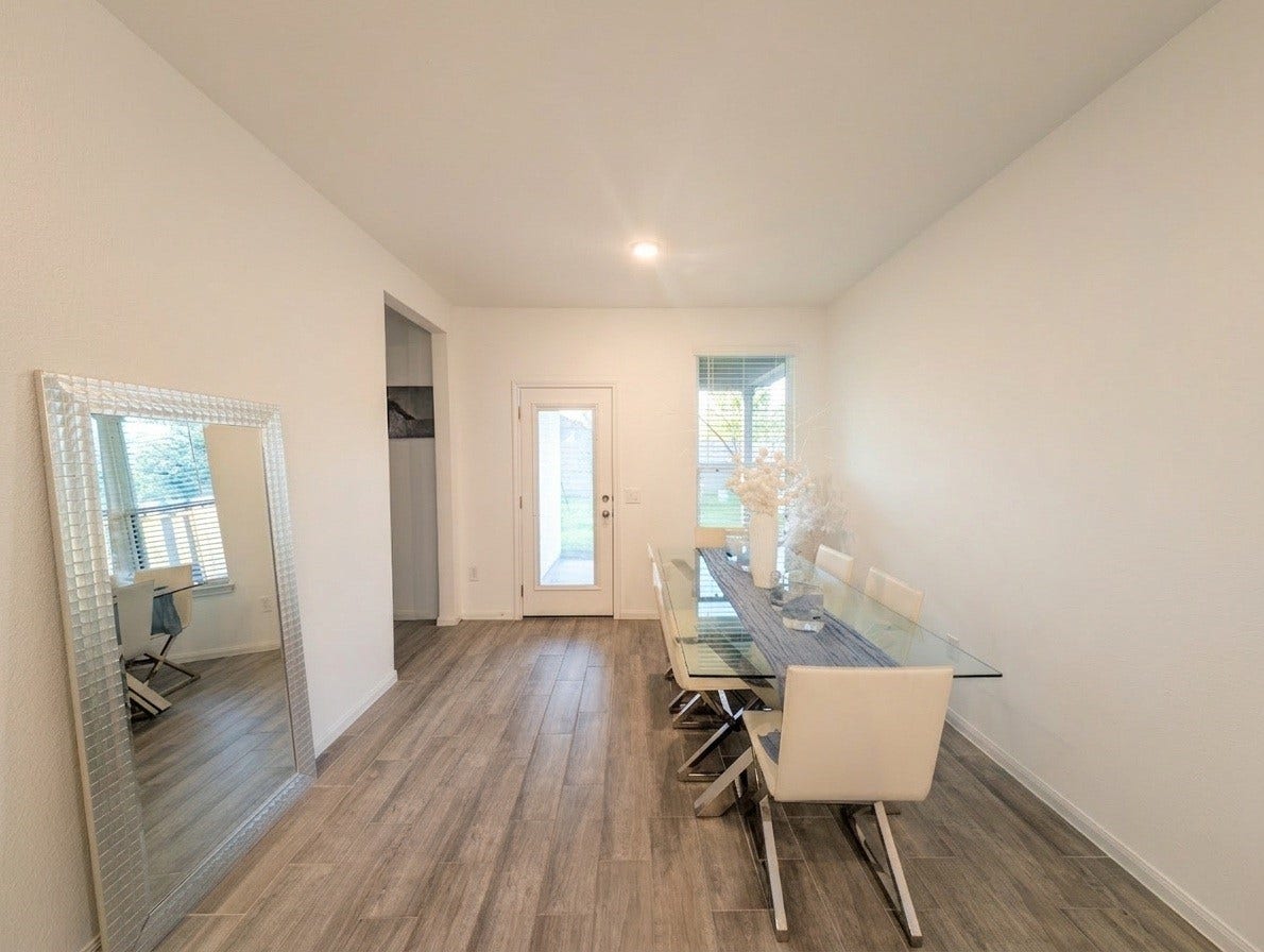 18122 Sonresa Way, Tomball, TX 77377 Casual dining space illuminated by natural light, positioned conveniently near the kitchen and main living areas.