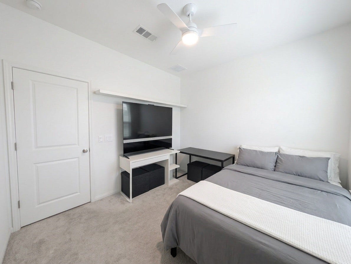18122 Sonresa Way, Tomball, TX 77377 Alternate angle of the secondary bedroom showcasing its spacious layout and natural lighting.