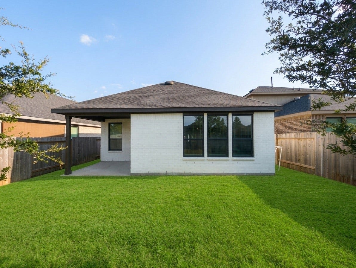 18122 Sonresa Way, Tomball, TX 77377 Generous backyard area showcasing privacy fencing and lush green turf.