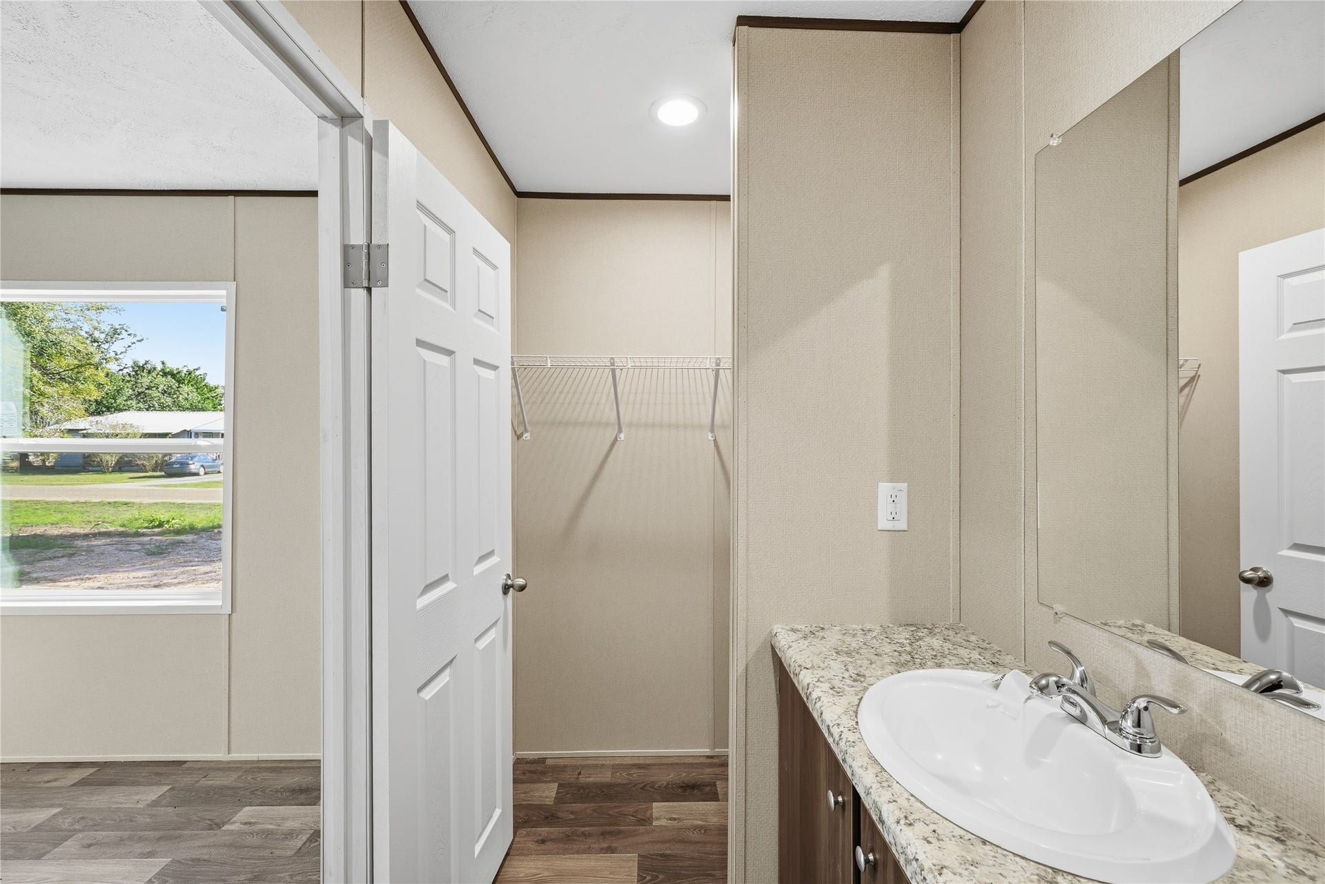 Primary bathroom and closet POV #2