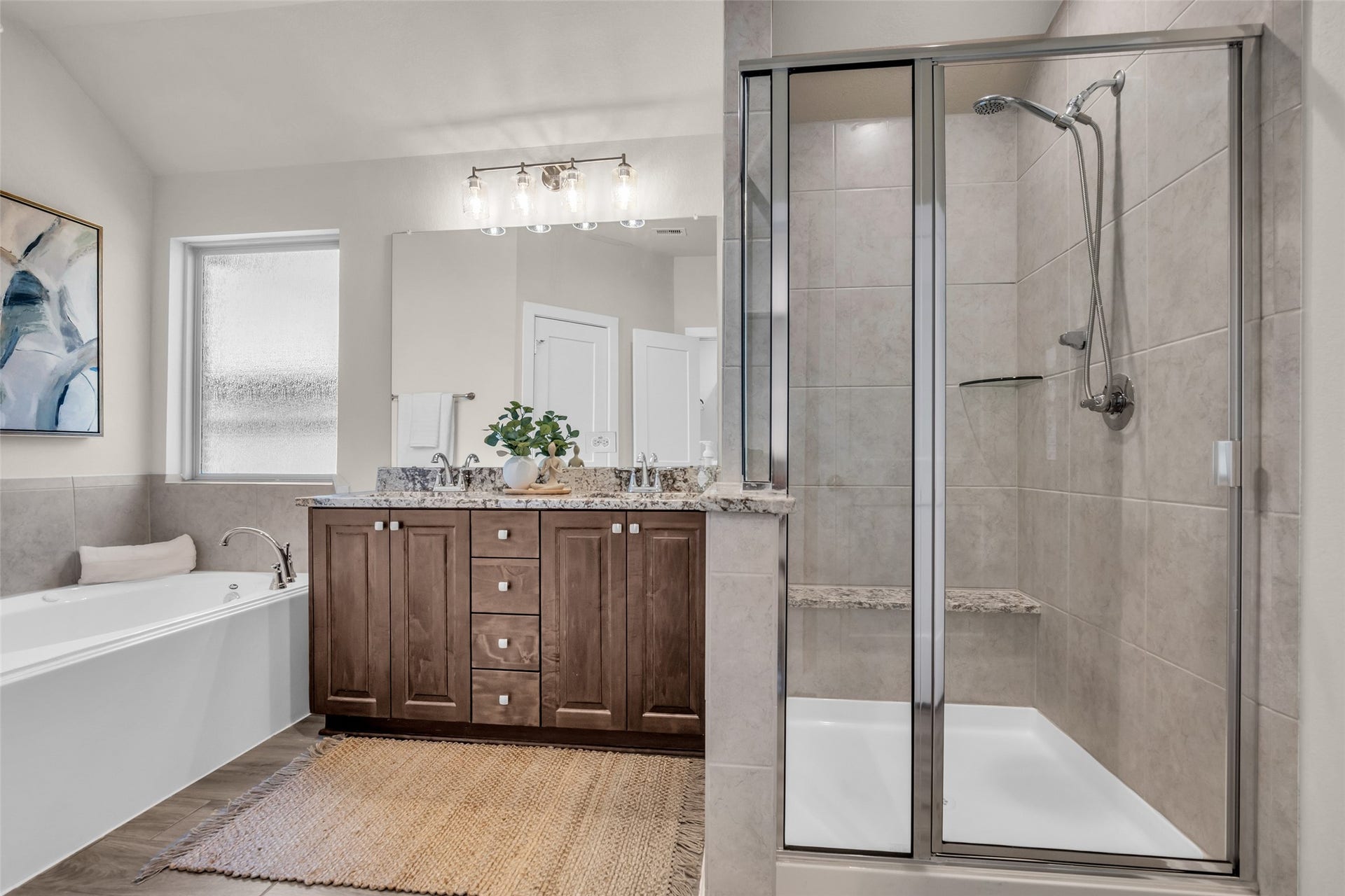 11935 Radura Road, Humble, TX 77346 Luxurious ensuite featuring dual vanities, soaking tub, and separate shower