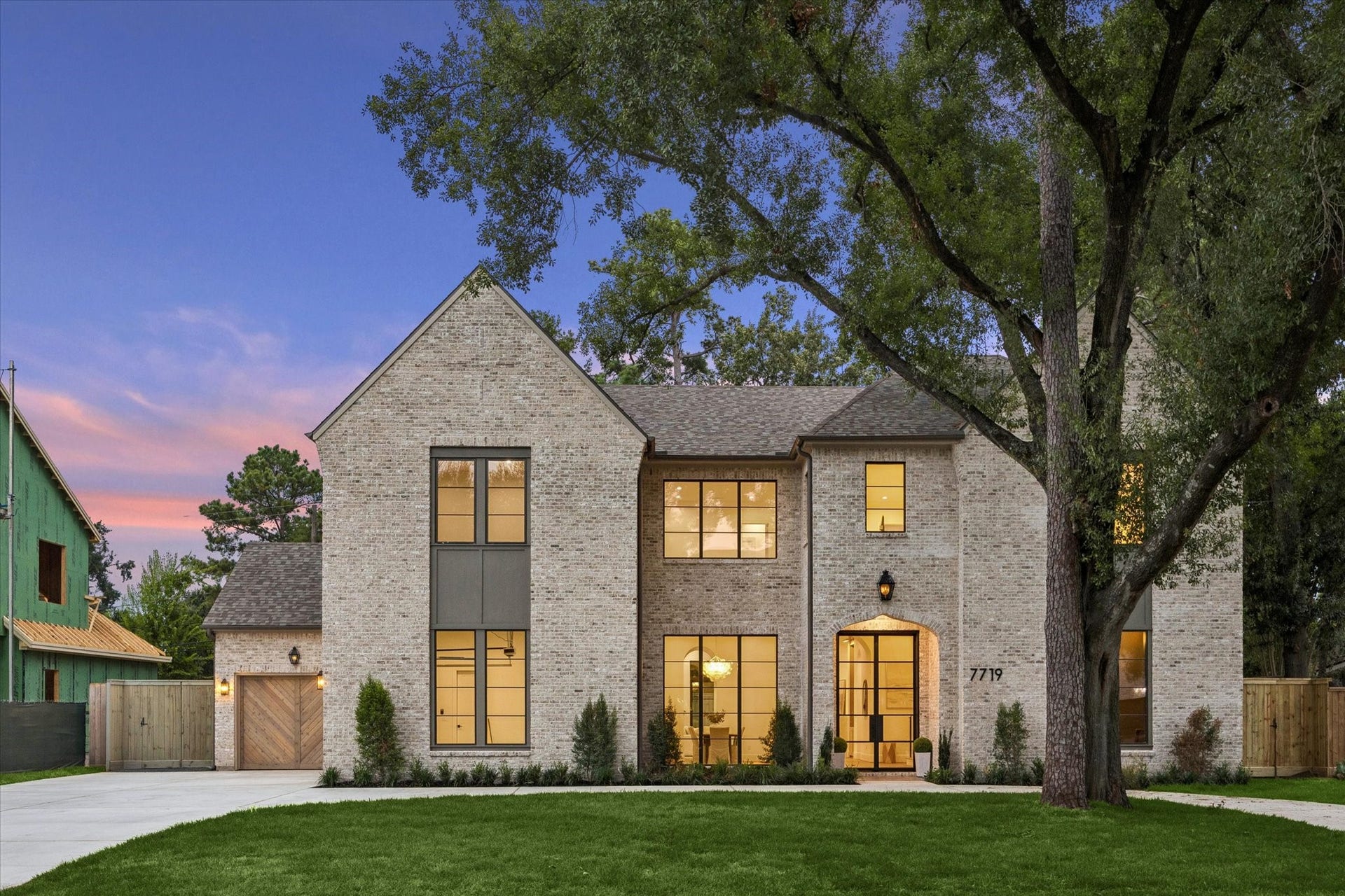7719 Bryonwood Drive, Houston, TX 77055 Mature trees frame the brick elevation on a 12,656 sq ft lot.