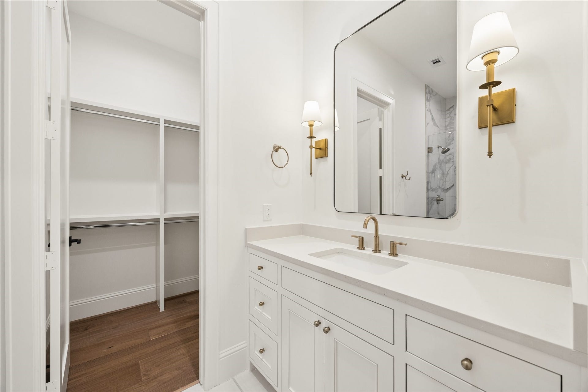 7719 Bryonwood Drive, Houston, TX 77055 Each secondary bedroom has an en-suite bath with brass fixtures and a walk-in closet.