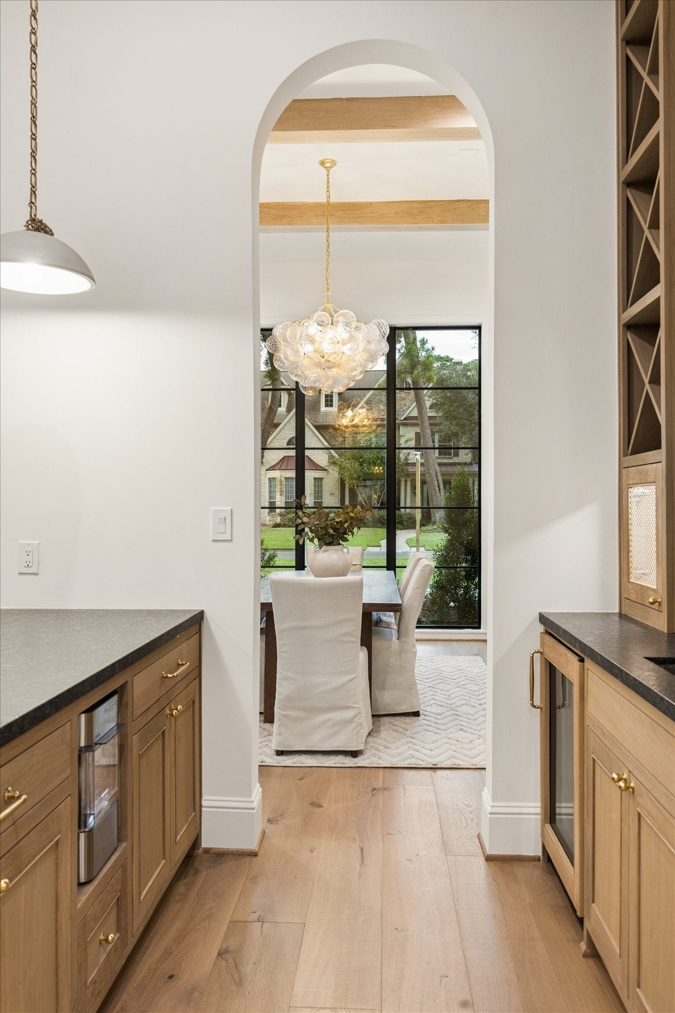7719 Bryonwood Drive, Houston, TX 77055 An arched opening leads from the butler's pantry into the formal dining room.
