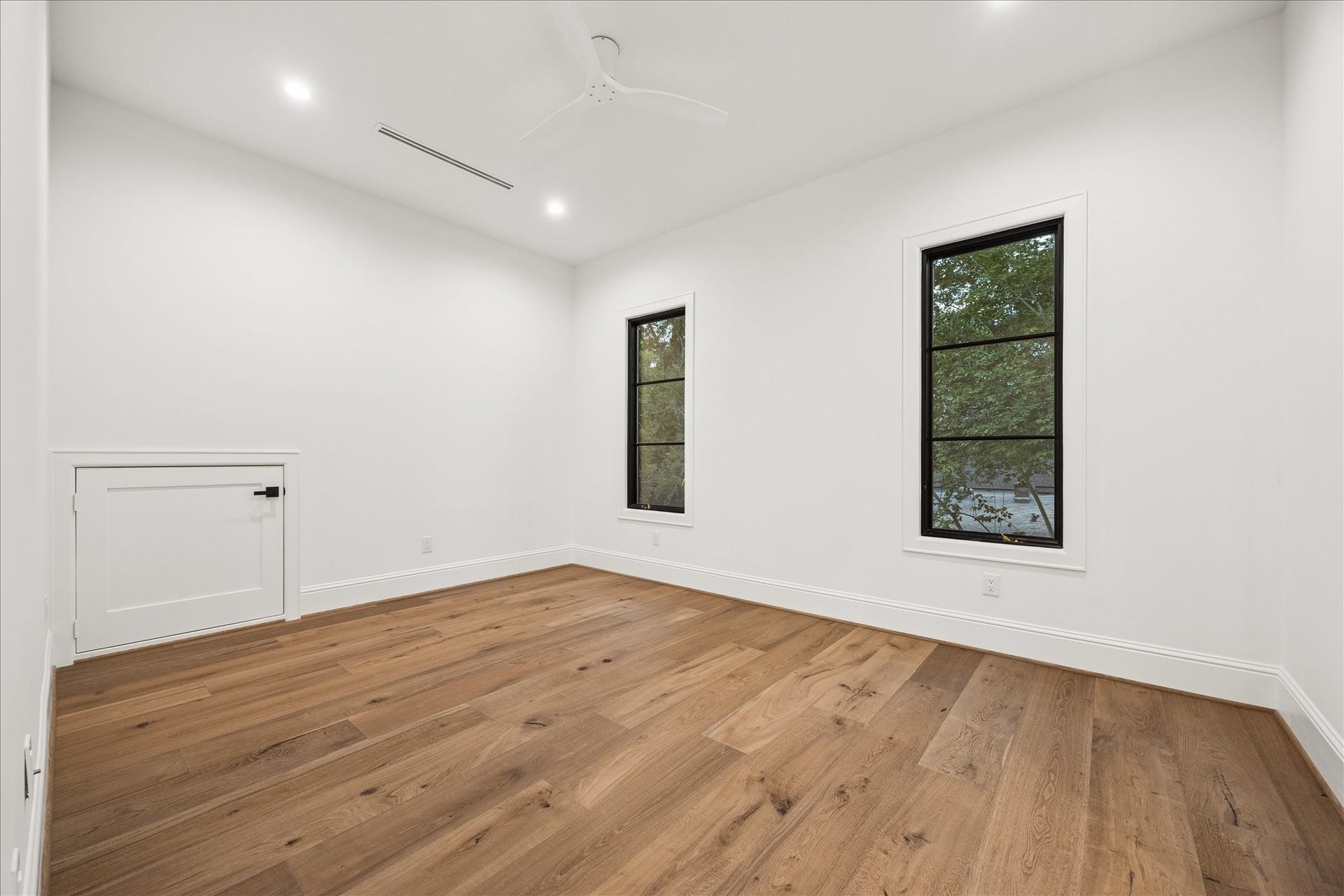 7719 Bryonwood Drive, Houston, TX 77055 Pella windows and wide-plank oak floors continue through every secondary bedroom.