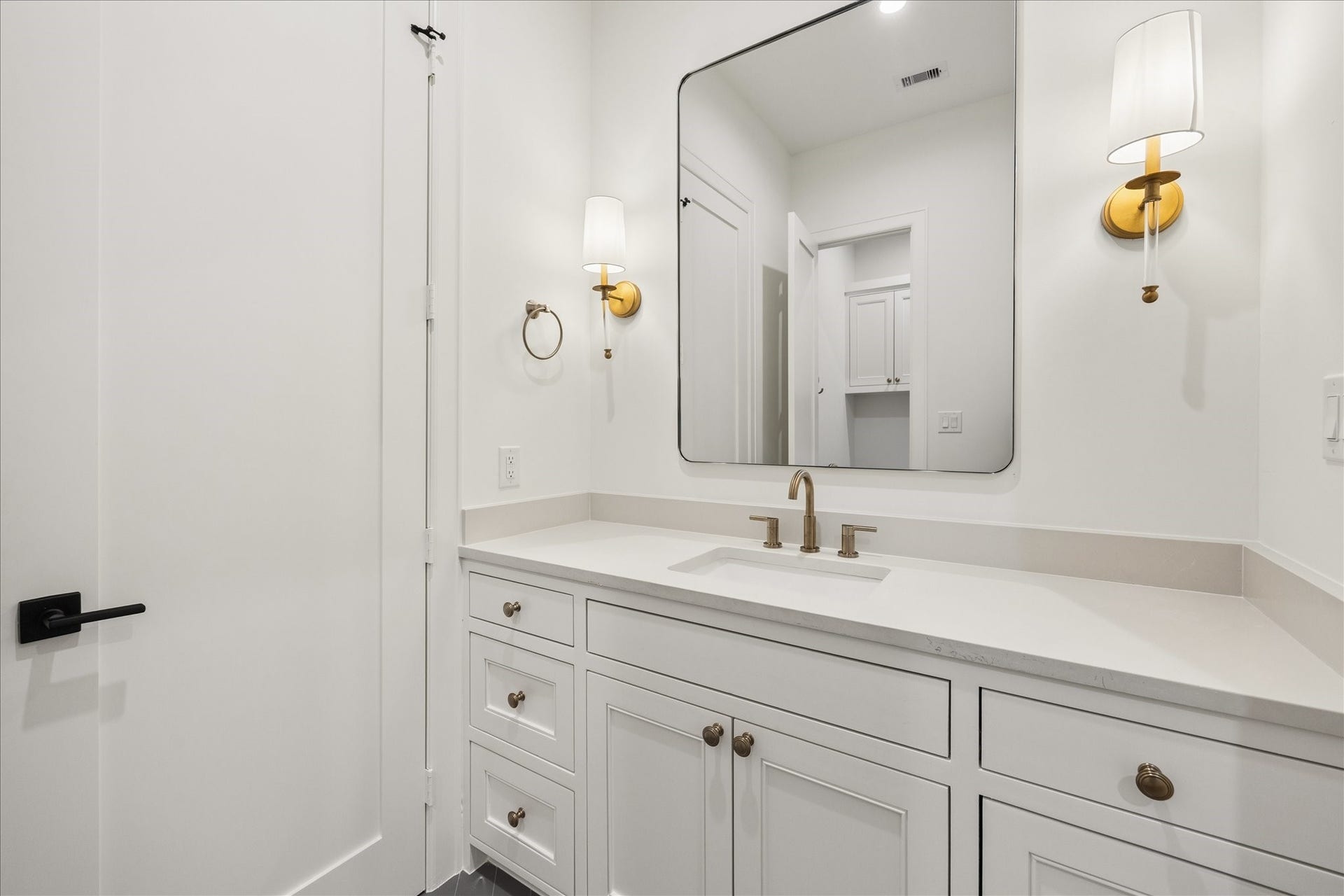 7719 Bryonwood Drive, Houston, TX 77055 White vanities offer generous storage in each secondary bath.