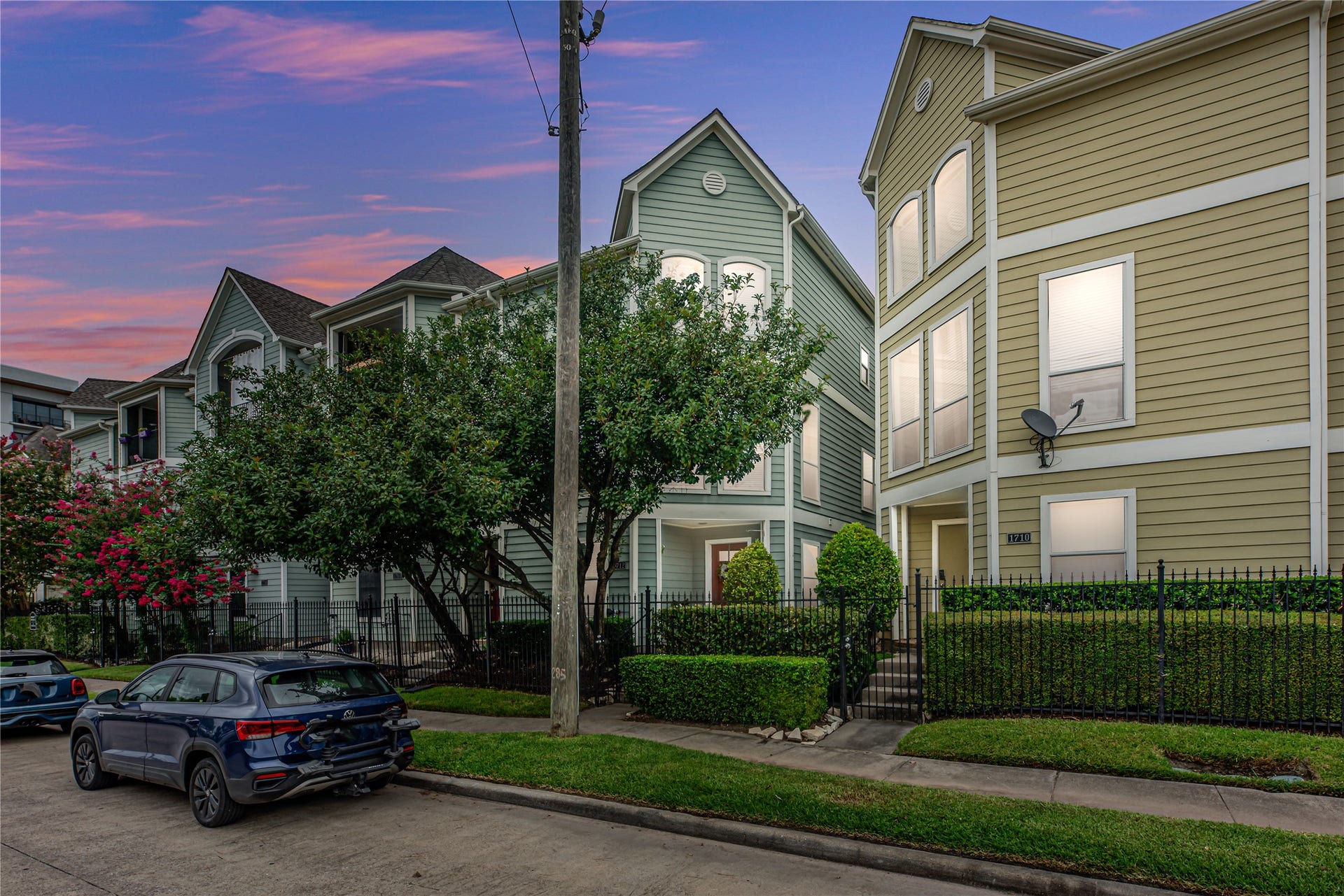 1712 Bevis Street, Houston, TX 77008 Located in the desirable Greater Heights area, this three-story townhome features a light exterior, a 2-car garage, and convenient street-front parking. A pedestrian-gated entrance leads to the front yard, offering added privacy and a welcoming entry to the home.