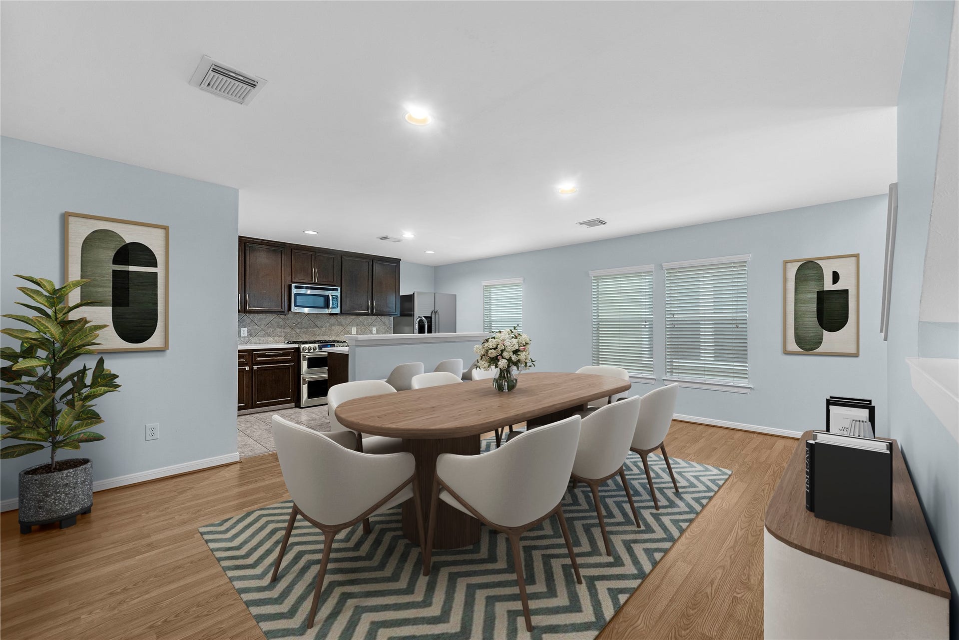 1712 Bevis Street, Houston, TX 77008 This virtually staged kitchen and dining area showcases rich brown cabinetry, granite countertops, a tile backsplash, and stainless steel appliances. The spacious layout offers plenty of room for everyday dining and entertaining.