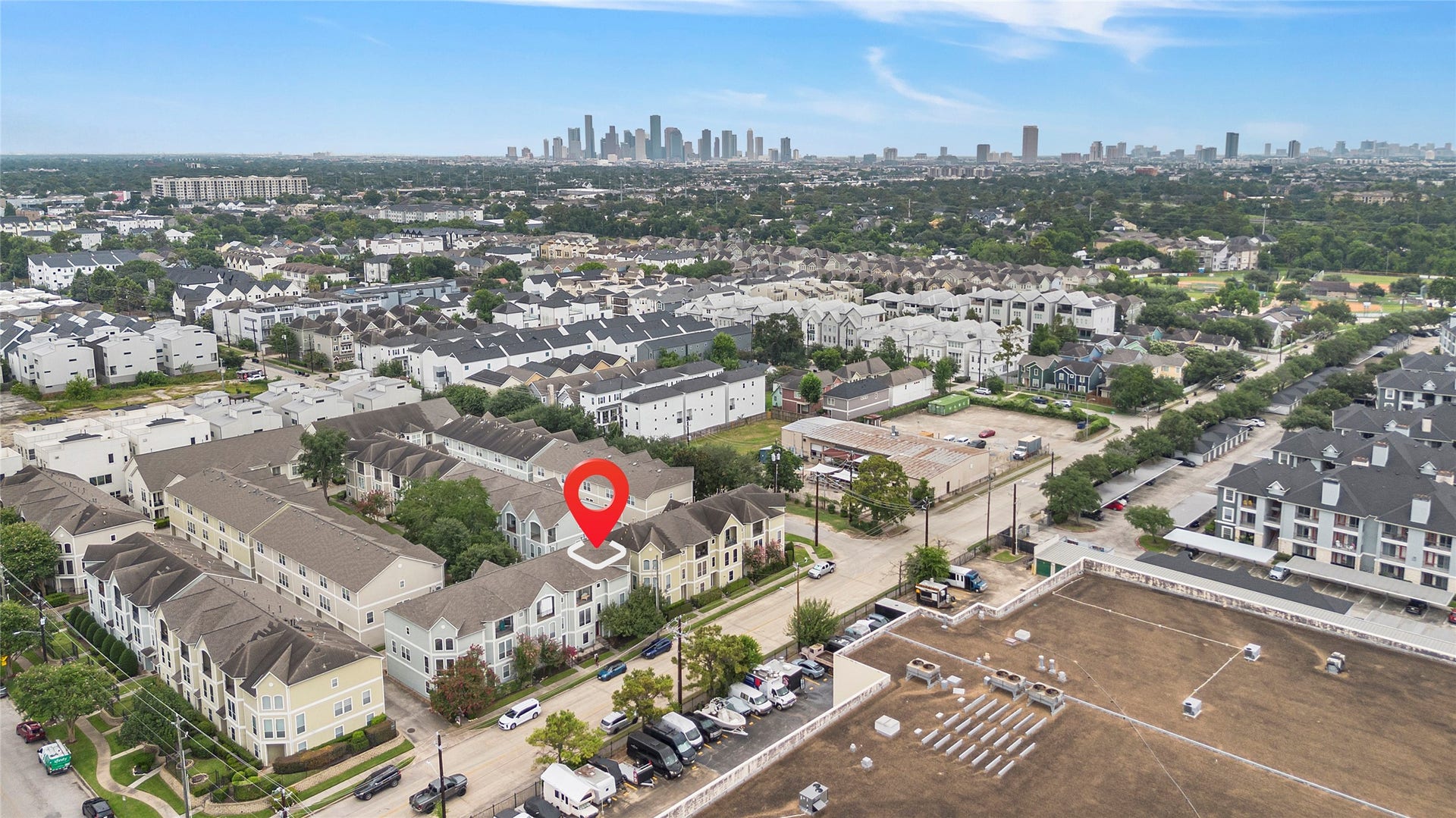 1712 Bevis Street, Houston, TX 77008 Location, location, location! This aerial view showcases the homes prime Greater Heights location, with Downtown Houston visible in the distance and convenient access to major roadways, parks, dining, shopping, and nearby city amenities.