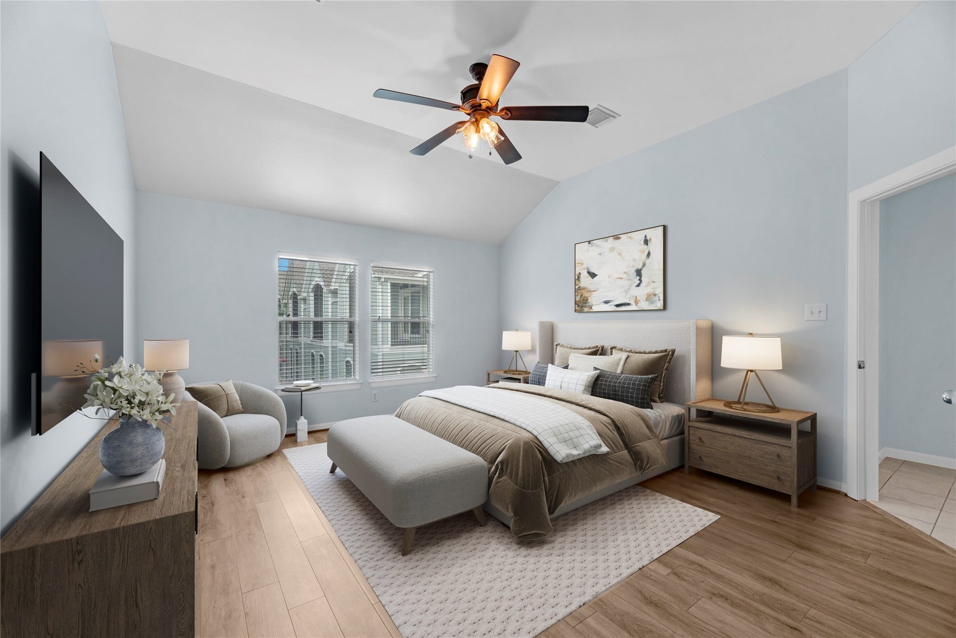 1712 Bevis Street, Houston, TX 77008 Located on the third floor, this spacious bedroom features high ceilings, two windows that bring in plenty of natural light, and an oversized walk-in closet with generous storage space. The upper-level location provides added privacy and a comfortable retreat within the home. (virtually staged)