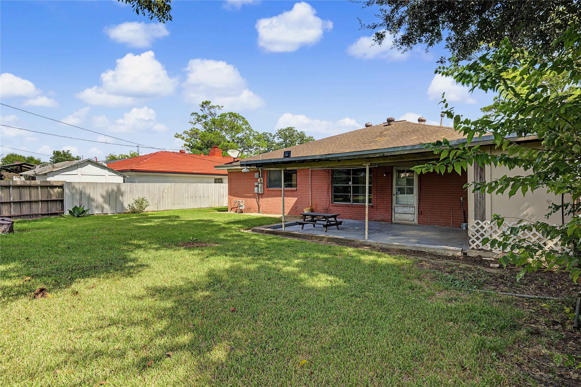 7510 Baneway Drive, Houston, TX 77072 Rear exterior view showcasing the patio area and generous lot potential.