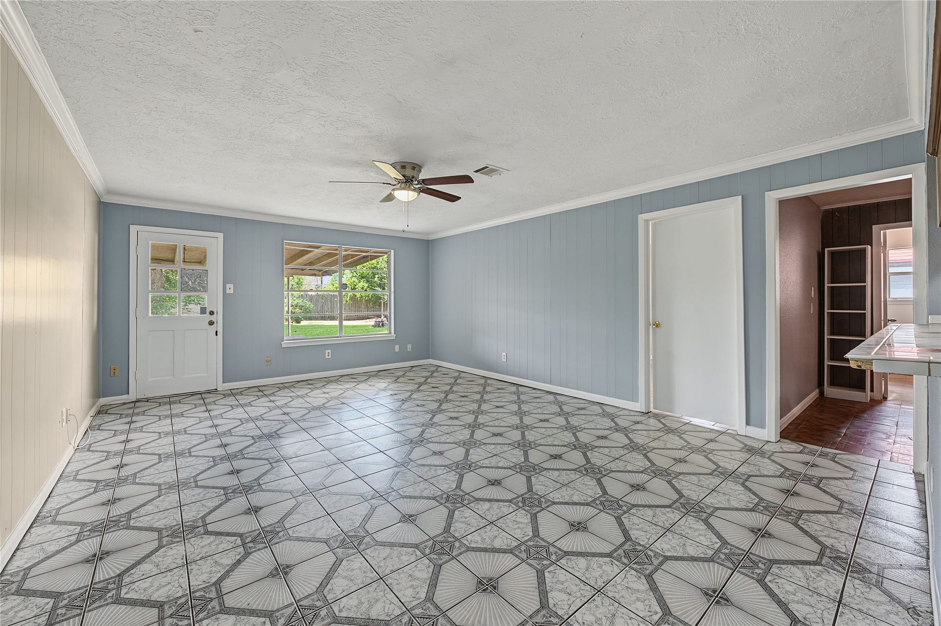 7510 Baneway Drive, Houston, TX 77072 Open living room showcasing freshly painted walls and great natural light.