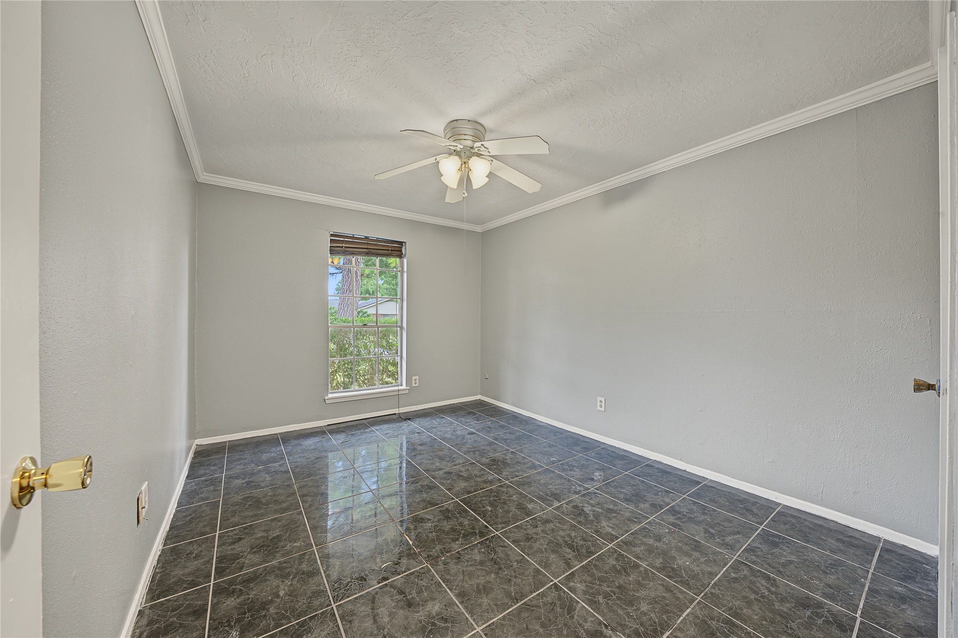 7510 Baneway Drive, Houston, TX 77072 Additional bedroom featuring fresh interior paint and tile flooring.
