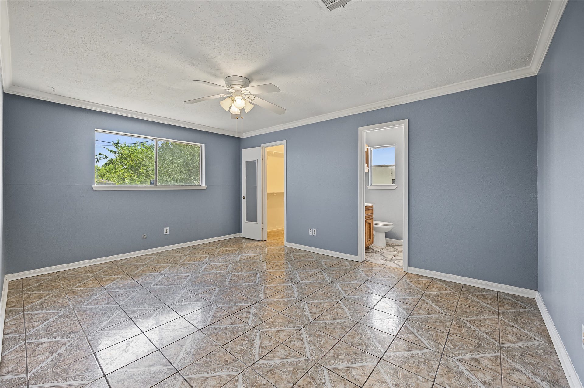 7510 Baneway Drive, Houston, TX 77072 Generously sized primary bedroom featuring fresh interior paint and great natural light.