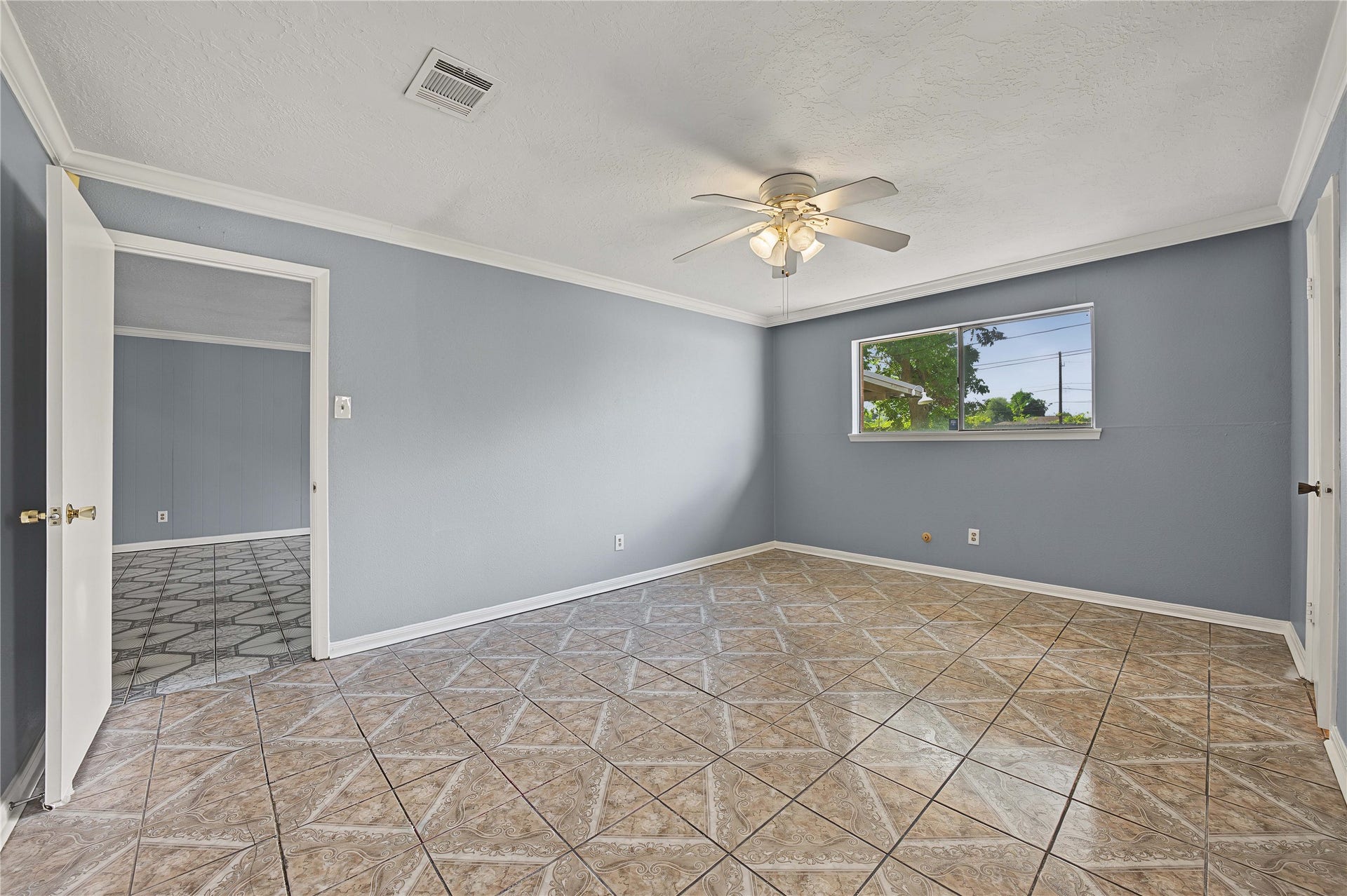 7510 Baneway Drive, Houston, TX 77072 Primary suite showcasing newly painted walls, tile flooring, and a bright, clean feel.