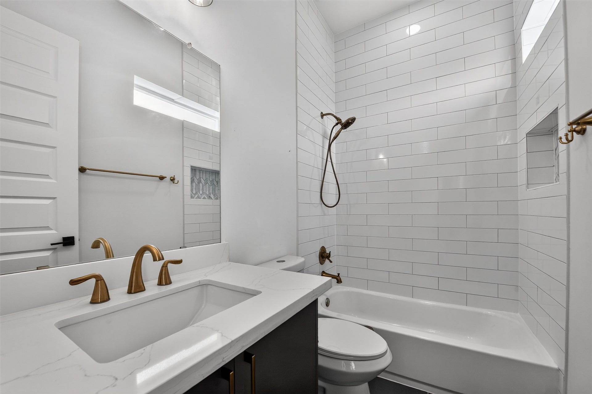 2911 Wichita Street, Houston, TX 77004 A refined secondary ensuite bath showcases a polished design, quality finishes, and a functional layout crafted for effortless daily living.