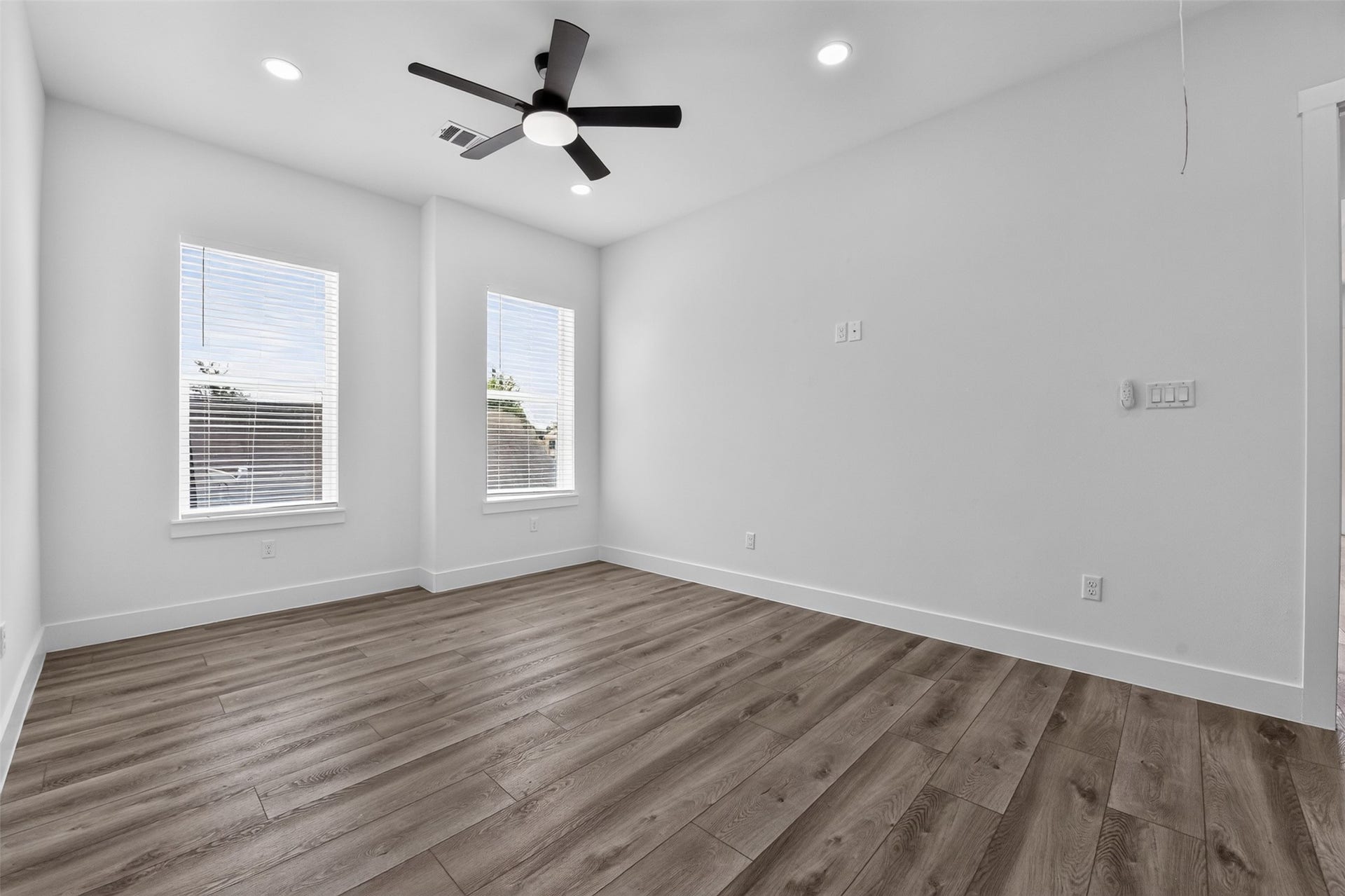 2911 Wichita Street, Houston, TX 77004 Abundant natural light streams through the windows of this secondary bedroom, enhancing the warmth and comfort of this private retreat.