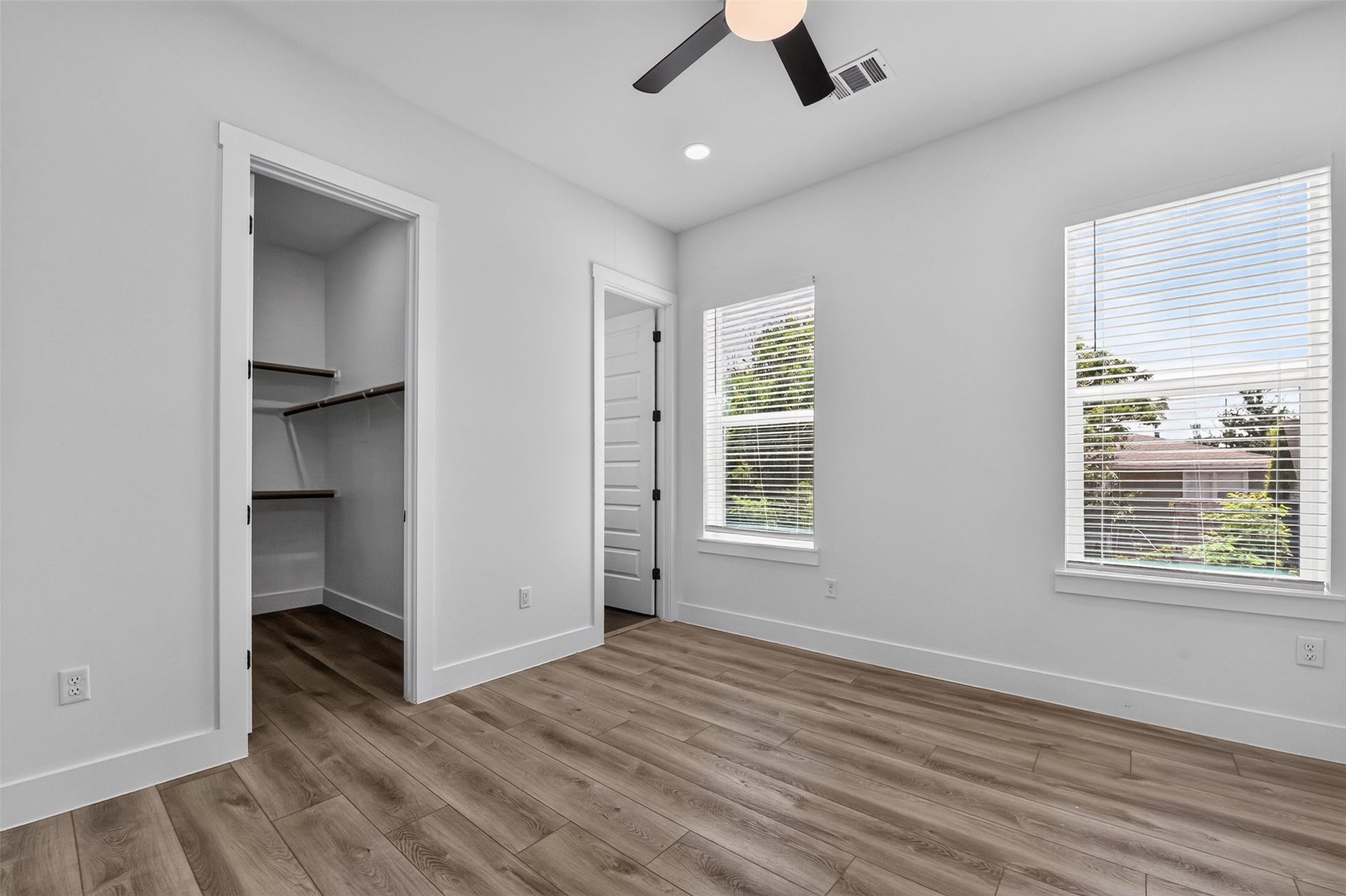 2911 Wichita Street, Houston, TX 77004 Take a look at this bedroom featuring generous natural light, a spacious closet, and a private ensuite bathoffering comfort, privacy, and thoughtful functionality.