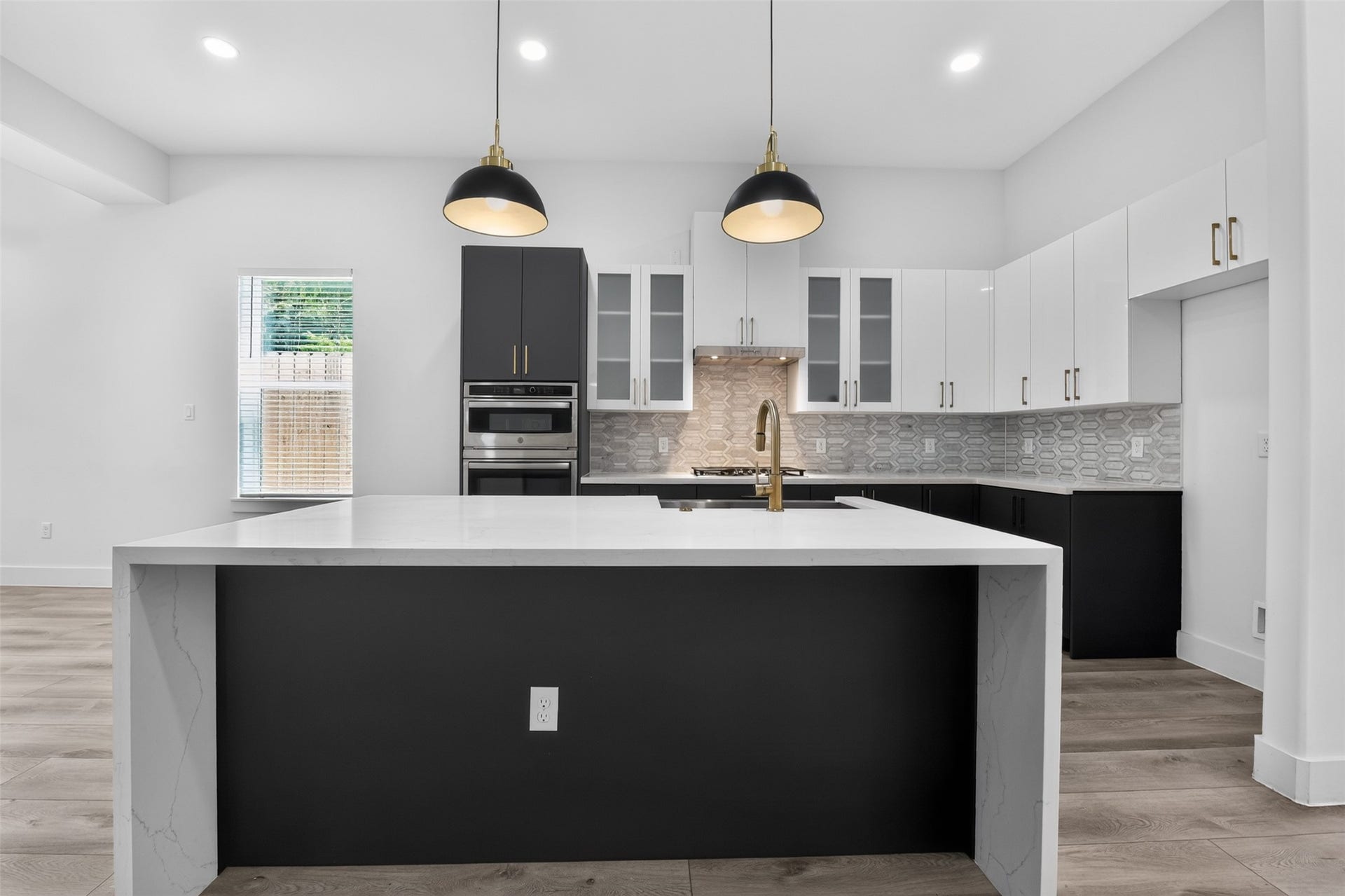 2911 Wichita Street, Houston, TX 77004 Every detail shines in this additional view of the stunning kitchen, highlighting the generous island, abundant cabinetry, and inviting open design.