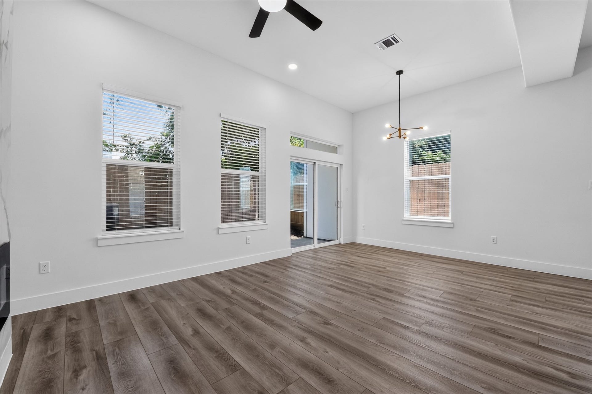 2911 Wichita Street, Houston, TX 77004 The outdoor retreat is framed by a tall privacy fence to create a serene and secluded backyard experience.