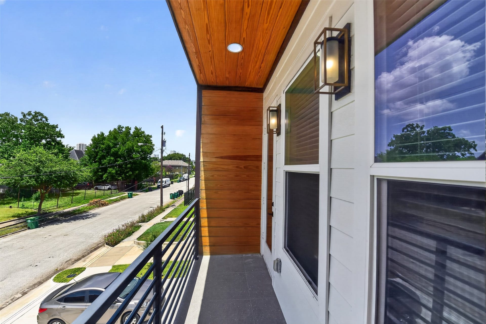 2911 Wichita Street, Houston, TX 77004 Step outside from the primary bedroom to a beautifully appointed covered balconya private escape designed for quiet moments and effortless indoor-outdoor living.
