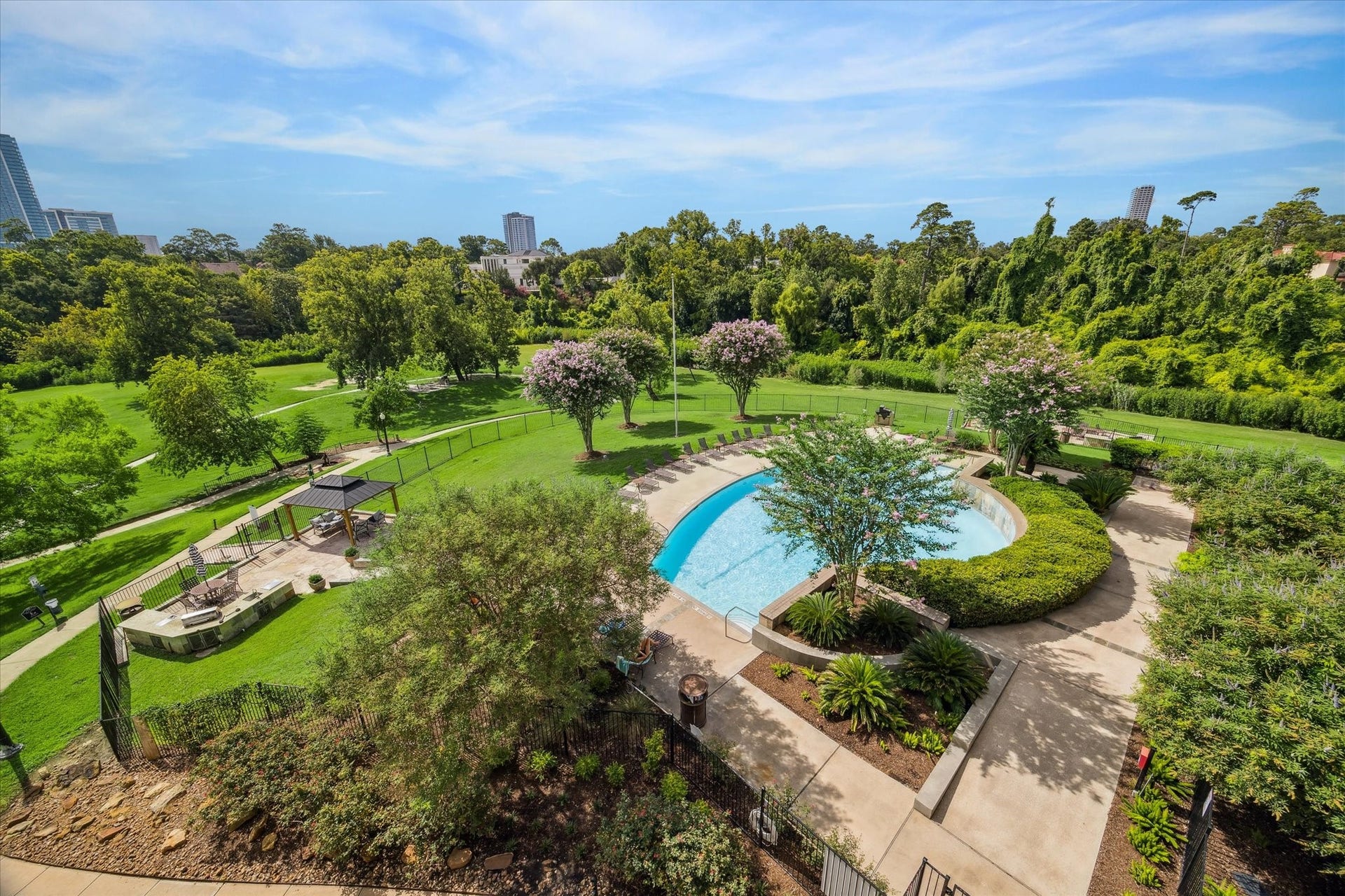5353 Memorial Drive, #1006, Houston, TX 77007 Gorgeous resort style lap pool with lots of tanquil green space.