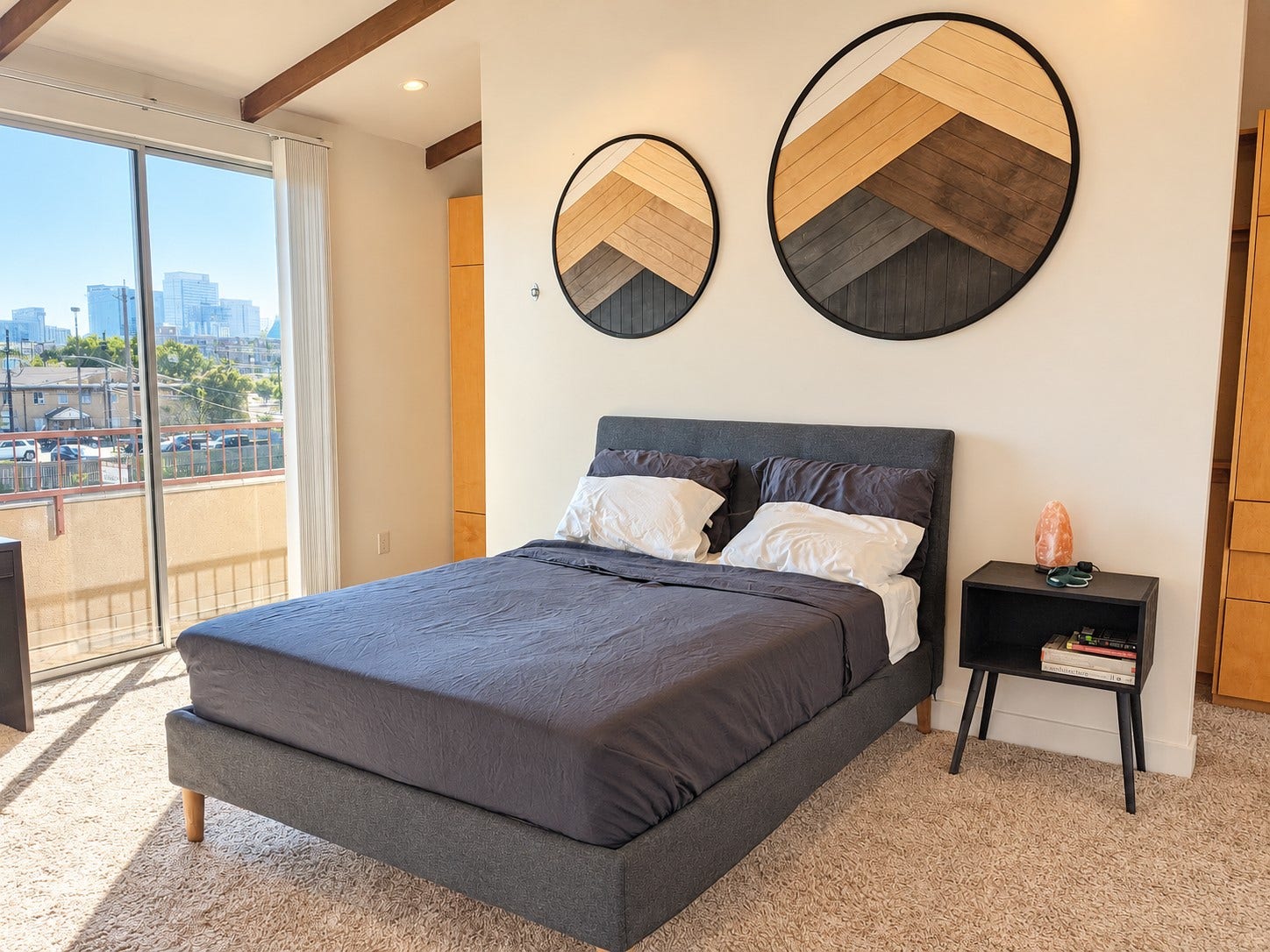 Beautifully furnished primary bedroom with plush bedding and a built-in closet.
