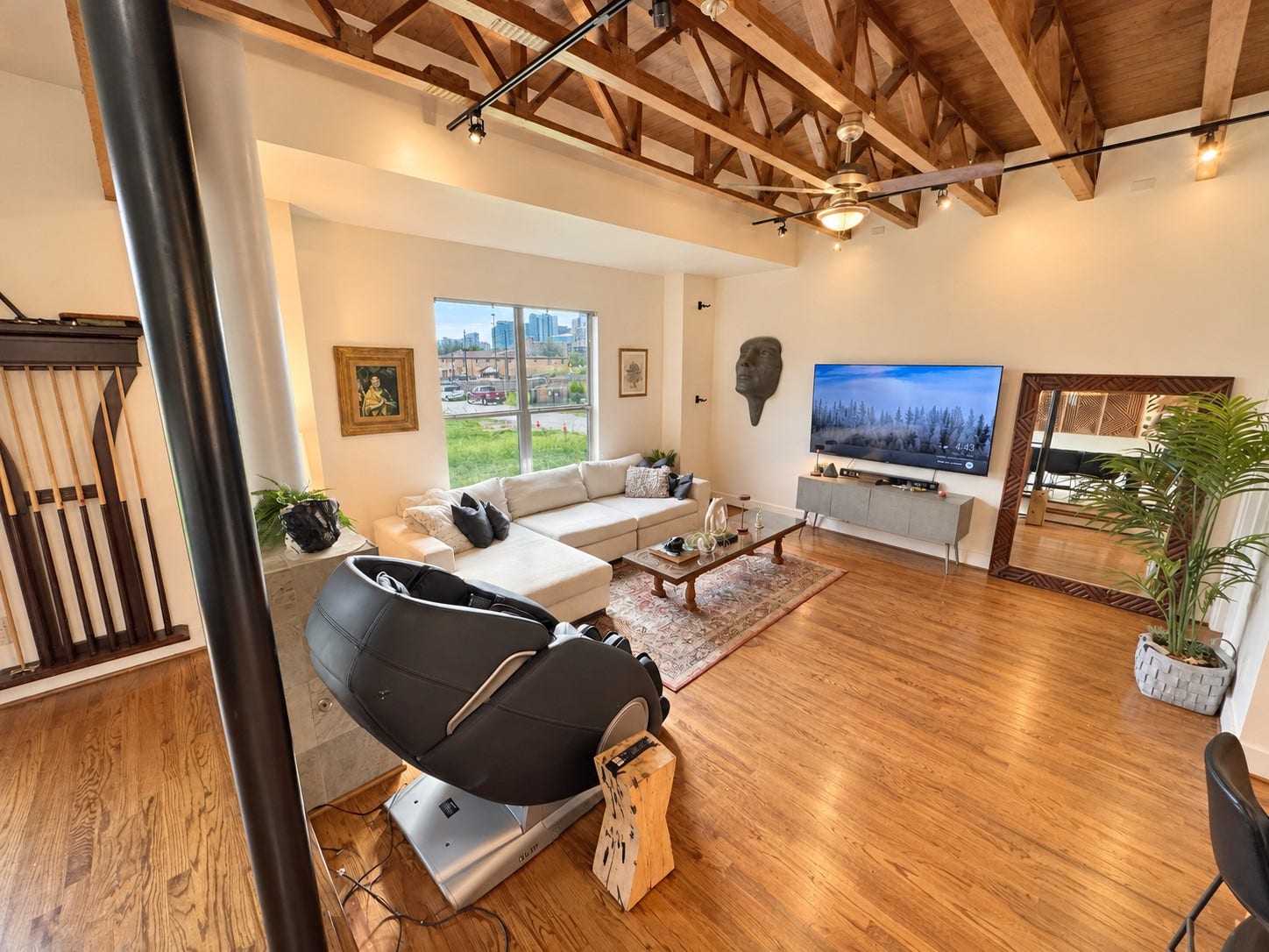 Inviting living space with thoughtfully curated artwork, comfortable furnishings, and a stylish design.