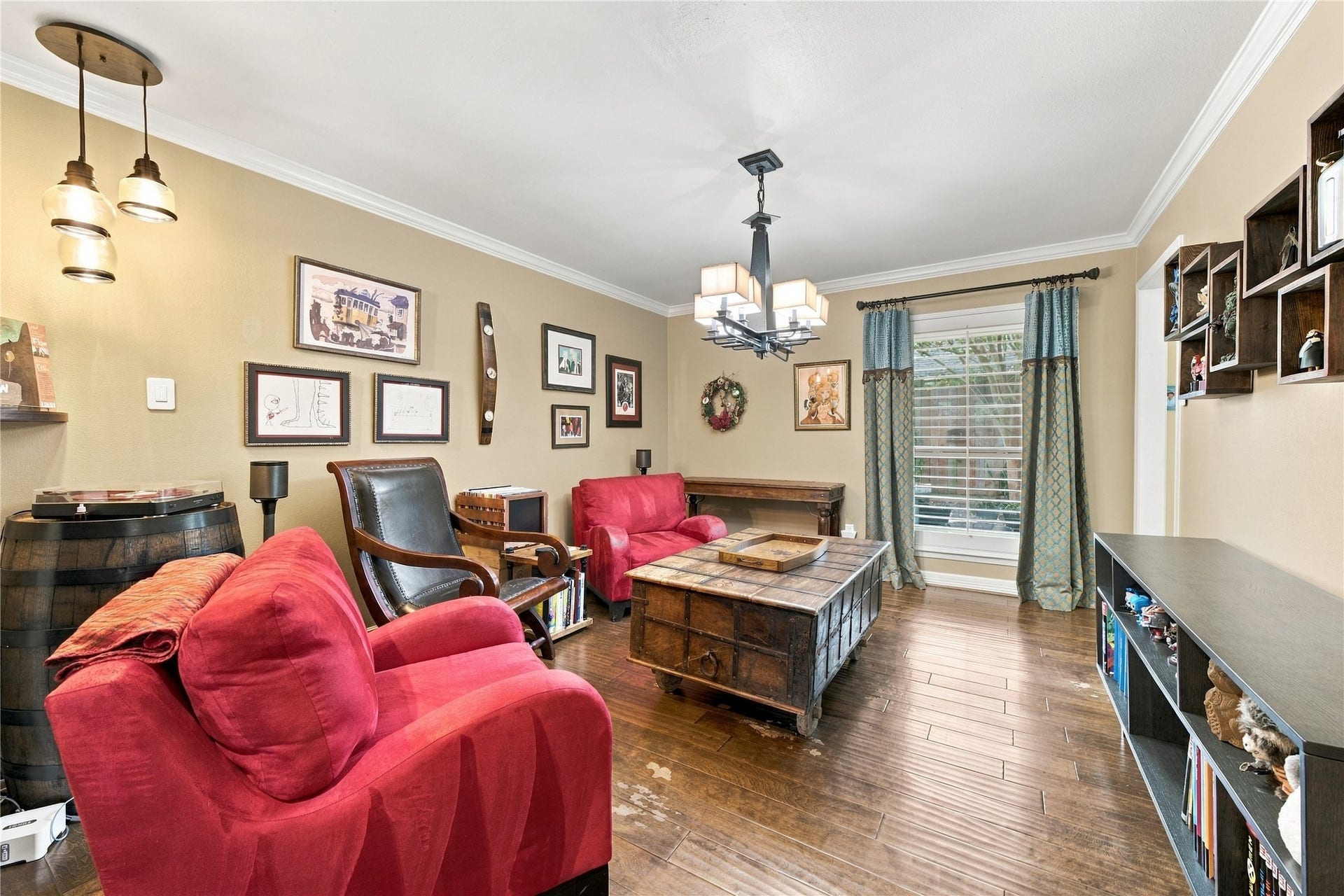 3211 Chris Drive, Houston, TX 77063 From the opposite corner, a pair of glass pendant lights adds warm accent lighting, and the doorway at the far end returns to the main hall.