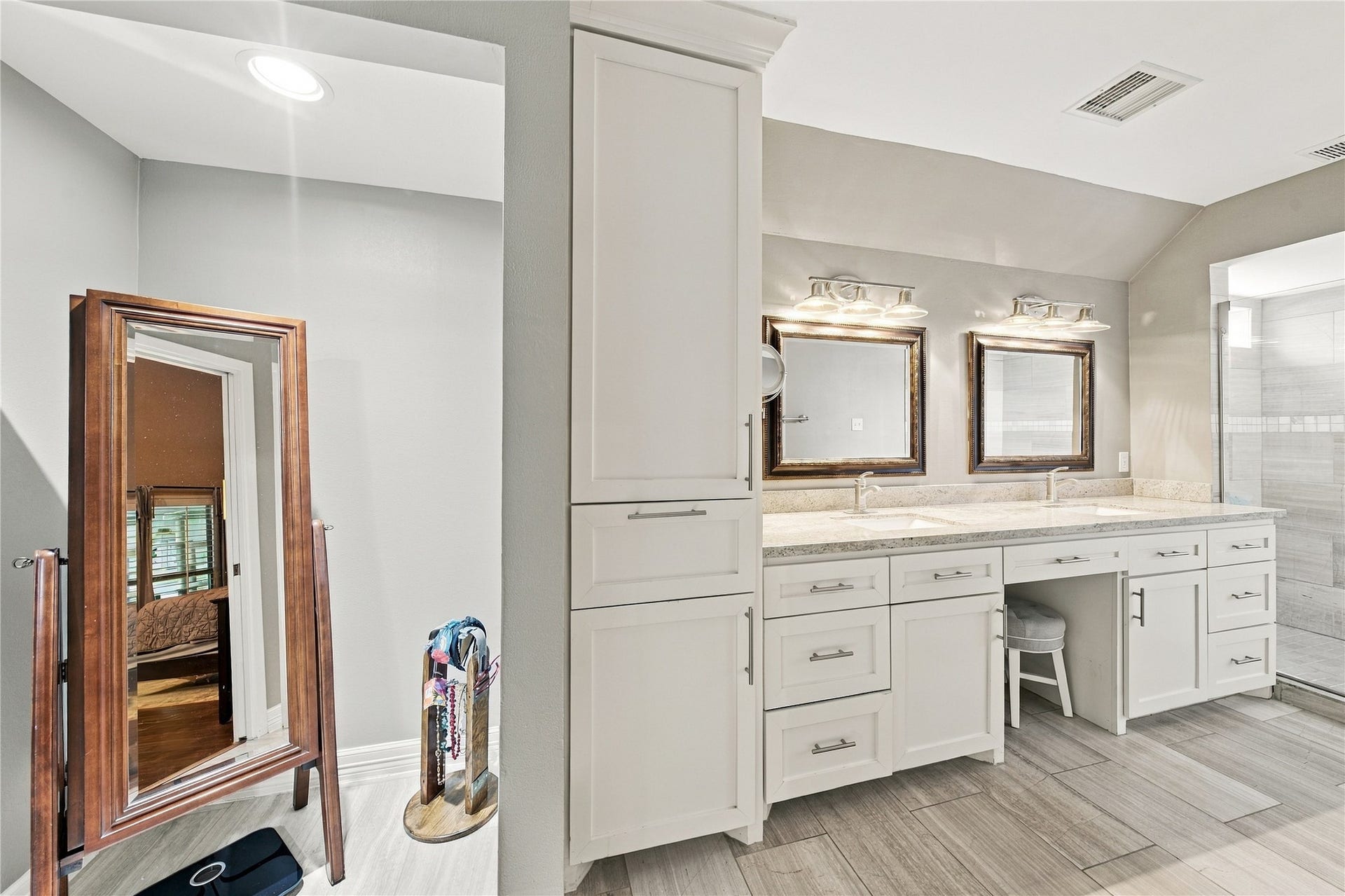 3211 Chris Drive, Houston, TX 77063 Additional cabinetry to the left of the double vanity offers excellent storage and additional linen space.
