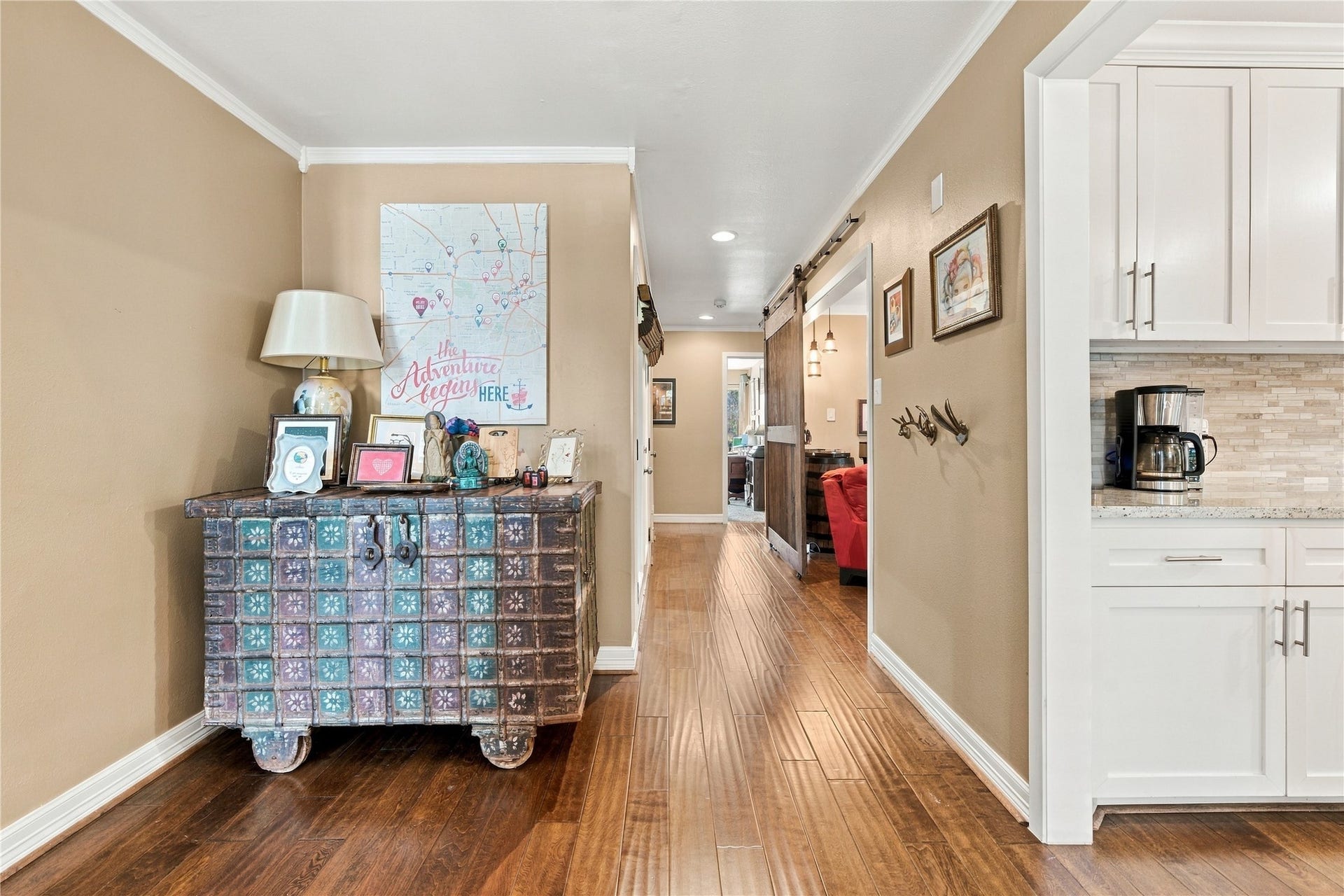 3211 Chris Drive, Houston, TX 77063 The dedicated entry way boasts engineered wood floors, crown molding & crisp white baseboards - The living room to the left and the kitchen to the right.