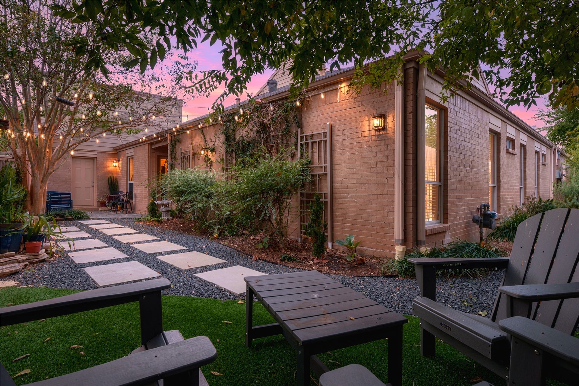 3211 Chris Drive, Houston, TX 77063 The courtyard truly comes alive at dusk! Thoughtful lighting, glowing wall sconces & climbing vines on the brick create a wonderful setting for evenings outside.