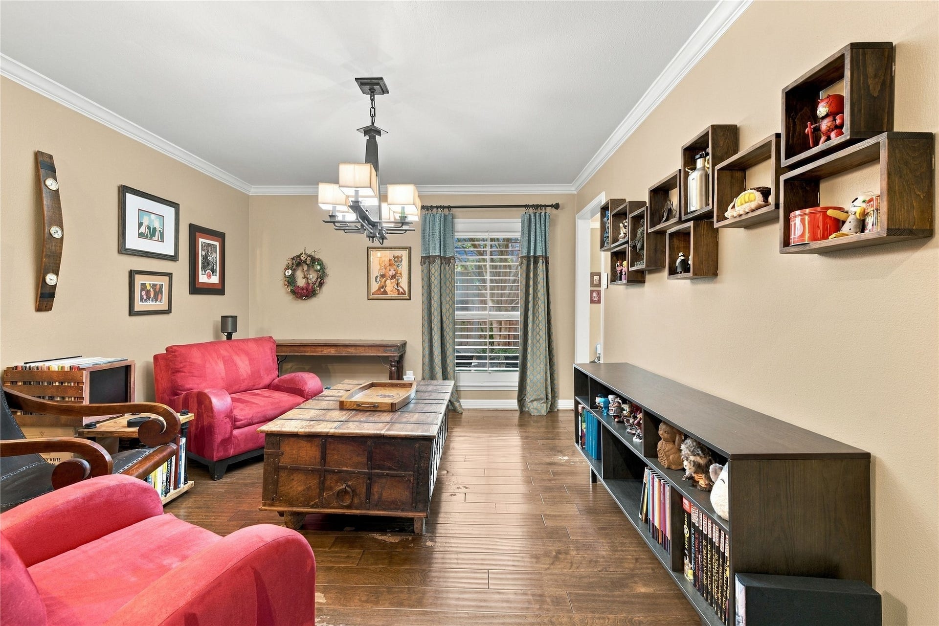 3211 Chris Drive, Houston, TX 77063 The room's long proportions offer flexibility for formal dining, a den, or a home library, with a plantation-shuttered window bringing in soft natural light.