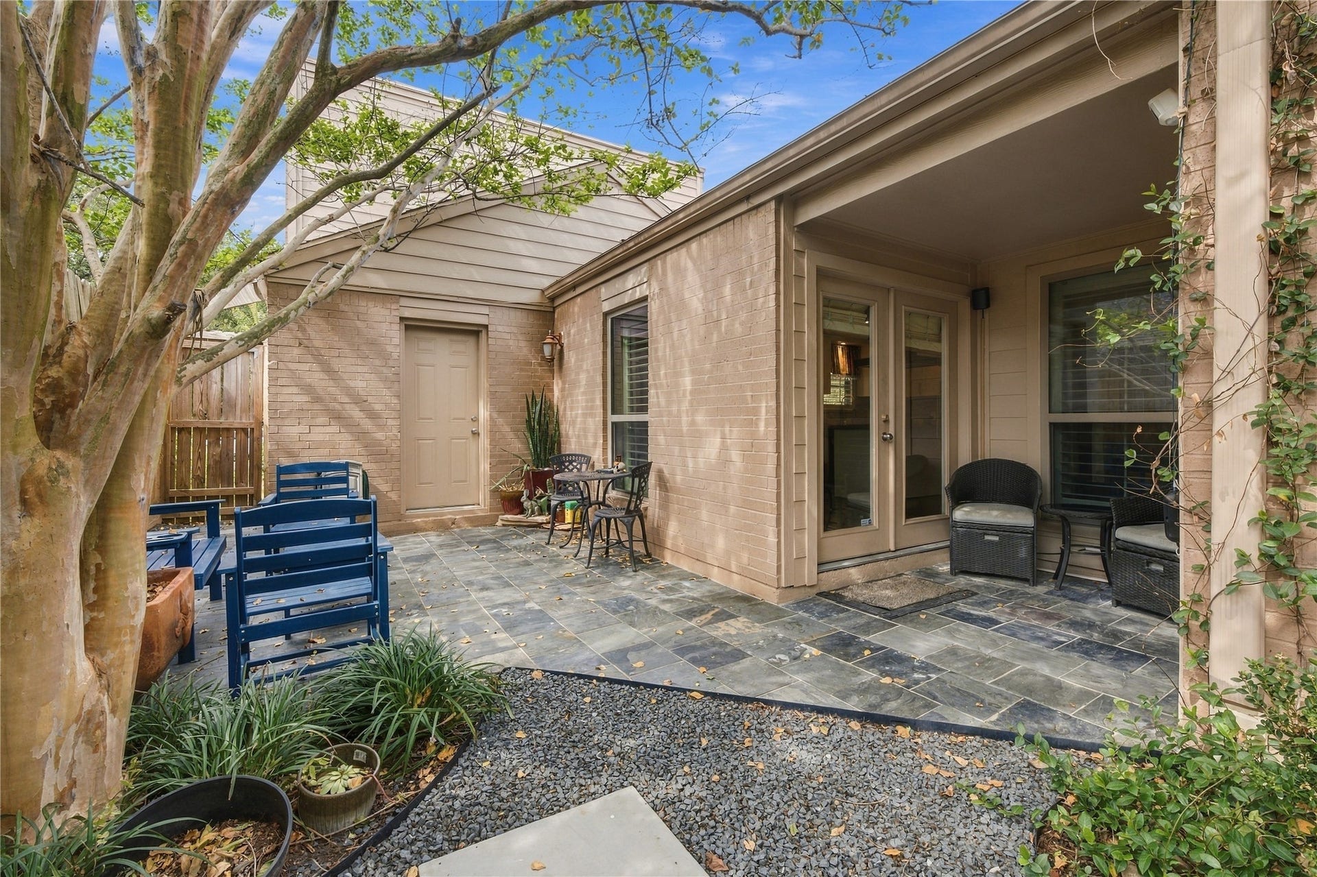 3211 Chris Drive, Houston, TX 77063 Stepping outside from the kitchen, a small covered patio opens to a paved outdoor seating space and travels back into a stunning outdoor retreat.