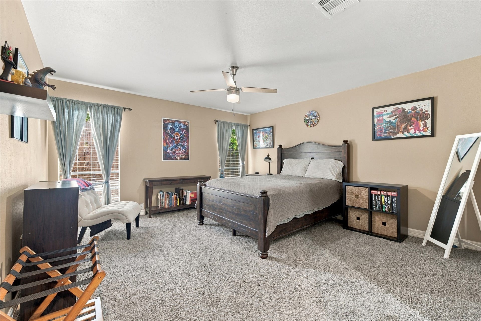 3211 Chris Drive, Houston, TX 77063 This spacious secondary bedroom offers generous floor space, plush carpet, and 2 large windows that flood the room with natural light.