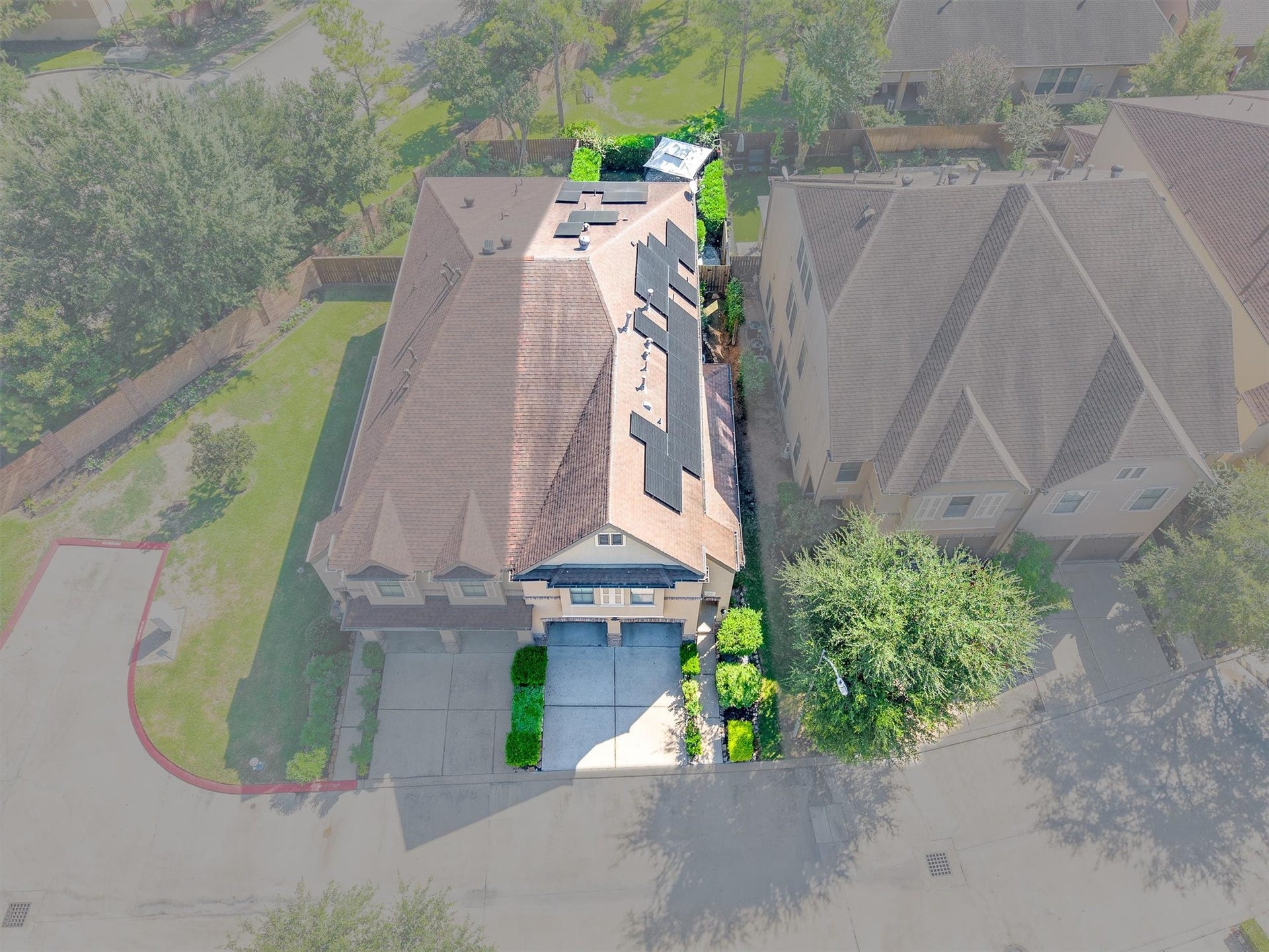 2919 Royal Oaks Crest, Houston, TX 77082 Charming two-story home with solar panels, nestled in a peaceful neighborhood, featuring a spacious driveway and lush greenery.