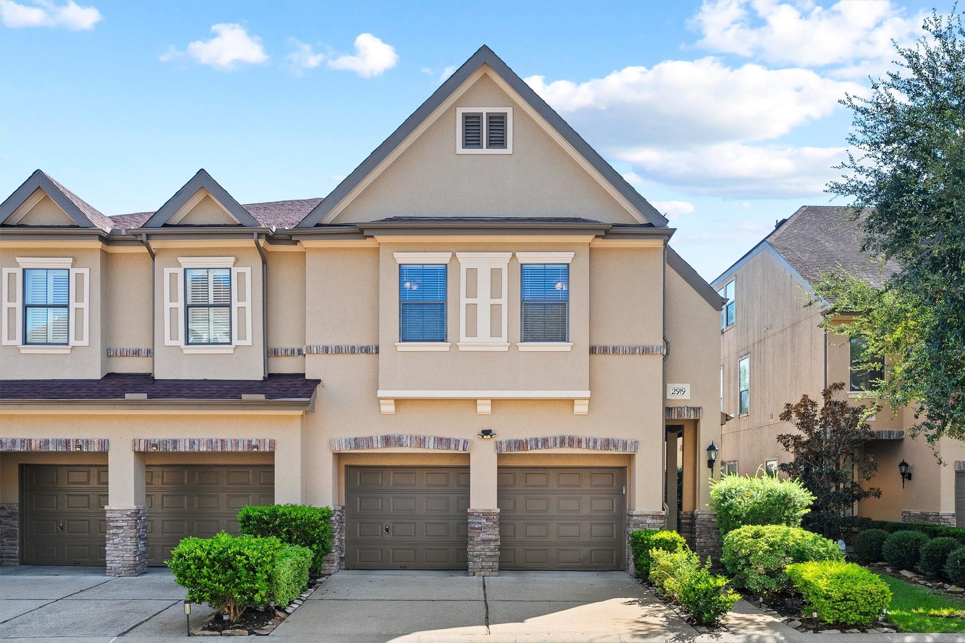 2919 Royal Oaks Crest, Houston, TX 77082 Nice townhouse with a classic facade, featuring a two-car garage and manicured landscaping, nestled in a desirable neighborhood.