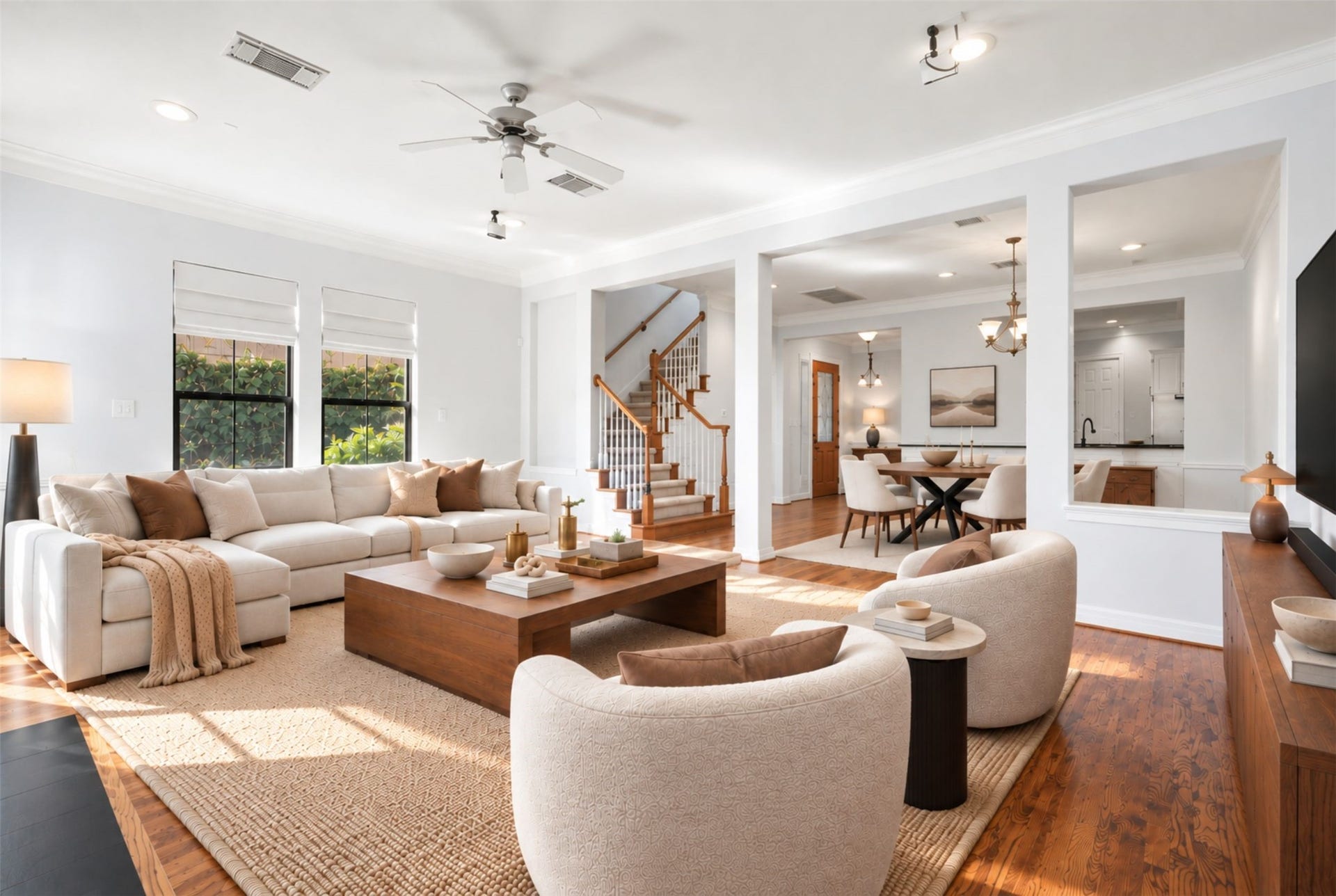 2919 Royal Oaks Crest, Houston, TX 77082 Experience modern elegance in this spacious living area, seamlessly connecting to a stylish dining space, perfect for entertaining and relaxation. (Virtual Staging)