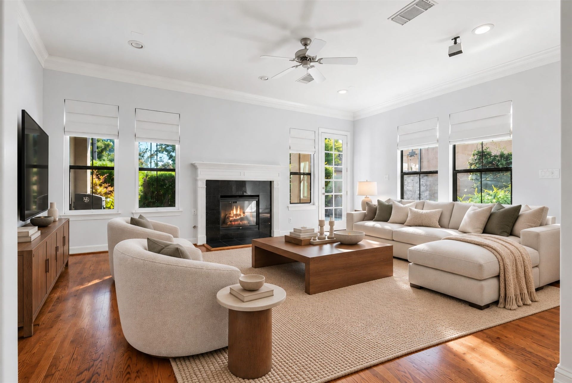 2919 Royal Oaks Crest, Houston, TX 77082 Experience the warmth and elegance of this living room, featuring a cozy fireplace and abundant natural light perfect for relaxation and entertainment. (Virtual Staging)