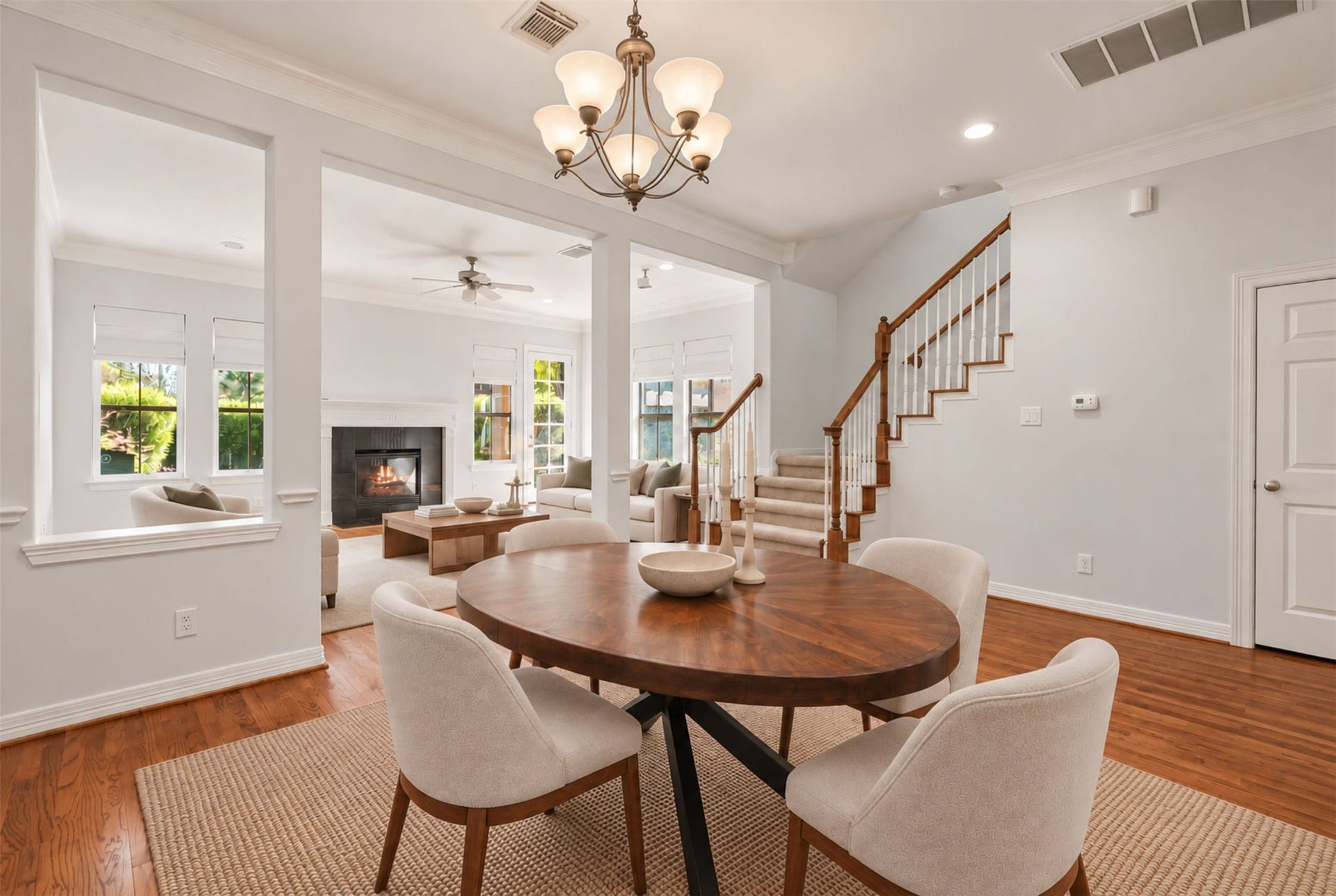 2919 Royal Oaks Crest, Houston, TX 77082 Experience the inviting charm of this open-concept living space, featuring a cozy fireplace, elegant dining area, and abundant natural light, perfect for modern living. (Virtual Staging)