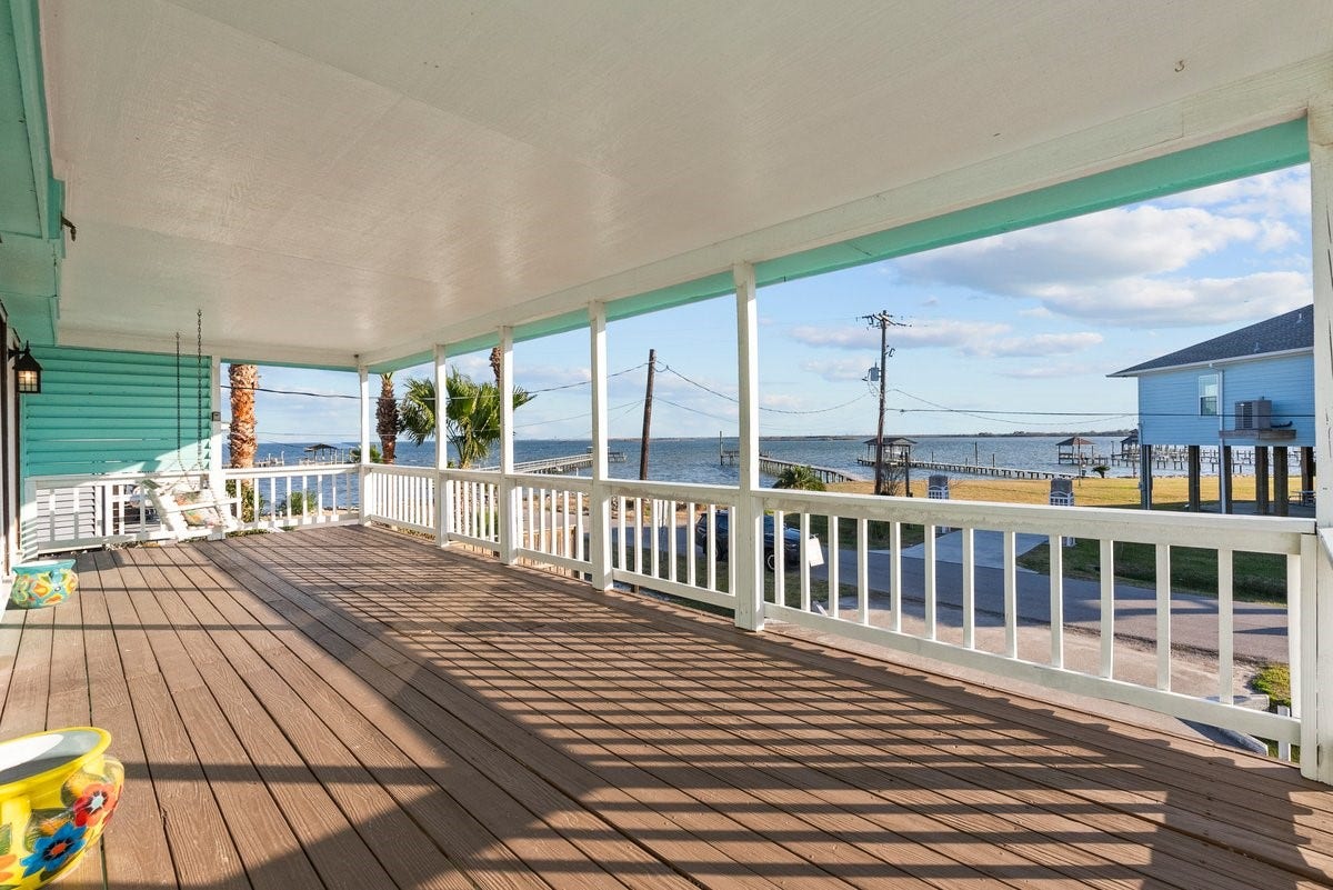 2406 Avenue P, San Leon, TX 77539 Spacious covered porch with bay views, perfect for relaxing and enjoying the coastal breeze.