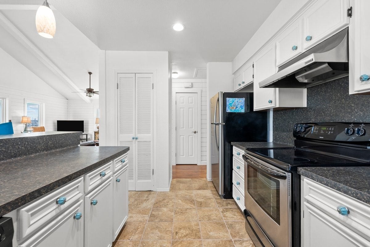 2406 Avenue P, San Leon, TX 77539 The space features tiled flooring and opens to a living area.