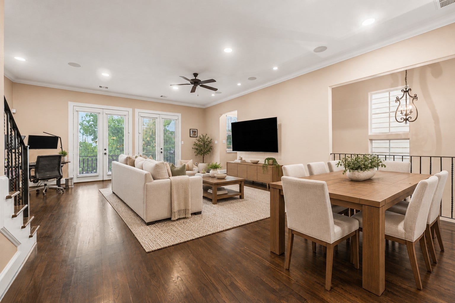 A view from the kitchen area to the Family/Living Room. The double set of french doors provide natural light and great for fresh air on those cool evenings.