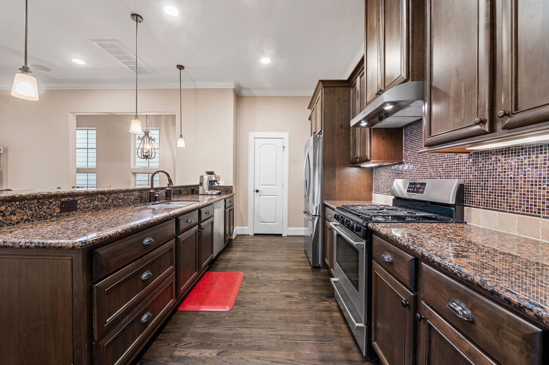 The galley style kitchen is set up in a "chef's triangle" manner and has tons of counter top space.