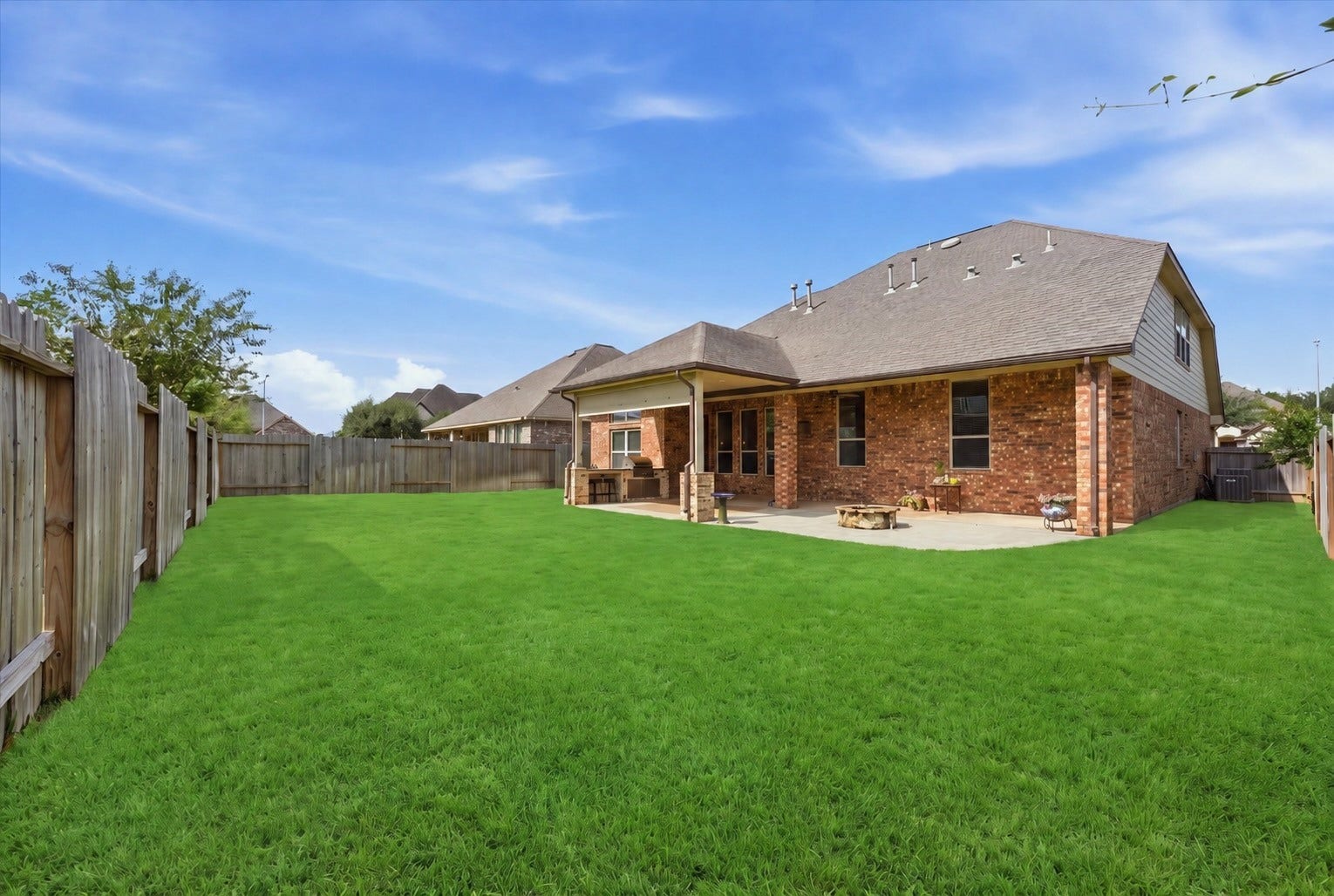 Your evenings belong here. An extended covered patio, built-in gas grill and gas fire pit create space to gather, with plenty of lawn left for play.