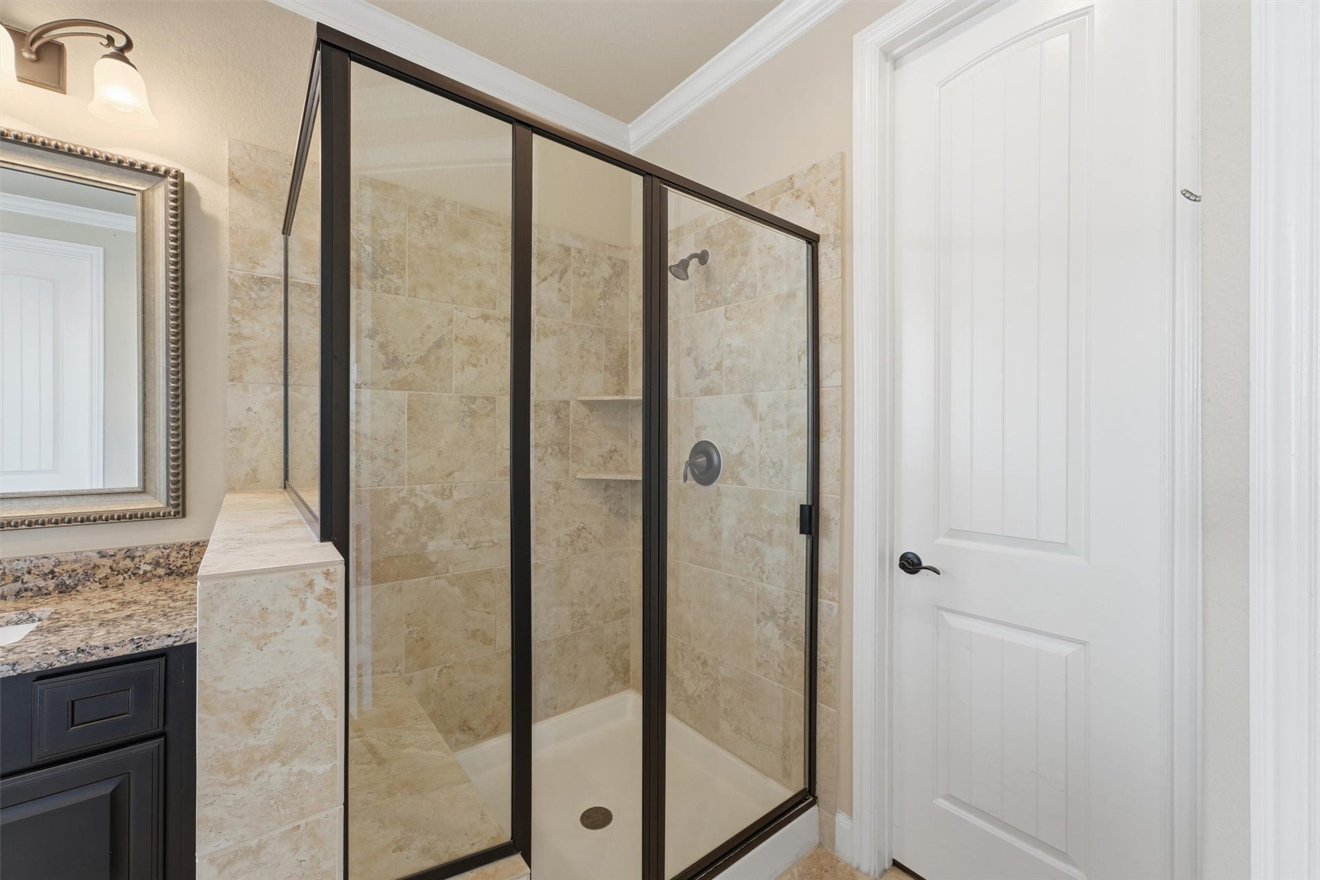 Primary bathroom with double sinks, jetted tub, separate shower, and large walk-in closet.