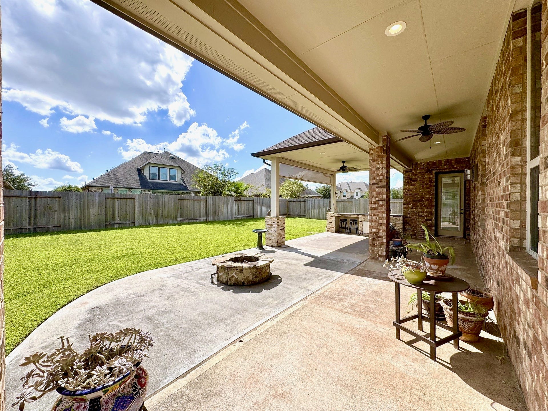 Your evenings belong here. An extended covered patio, built-in gas grill and gas fire pit create space to gather, with plenty of lawn left for play.